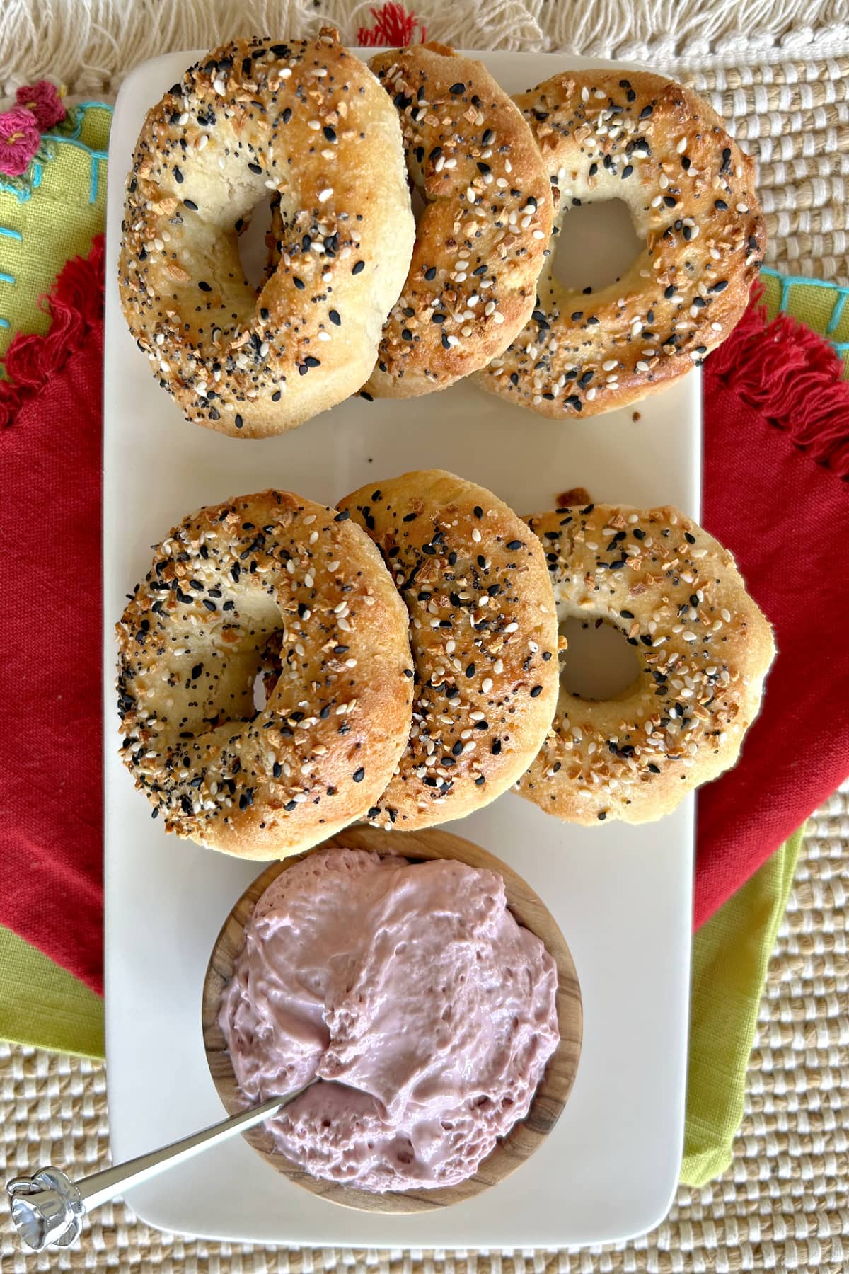 Almond Flour Bagels recipe from RecipeGirl.com almond flour bagels displayed on platter with berry cream cheese
