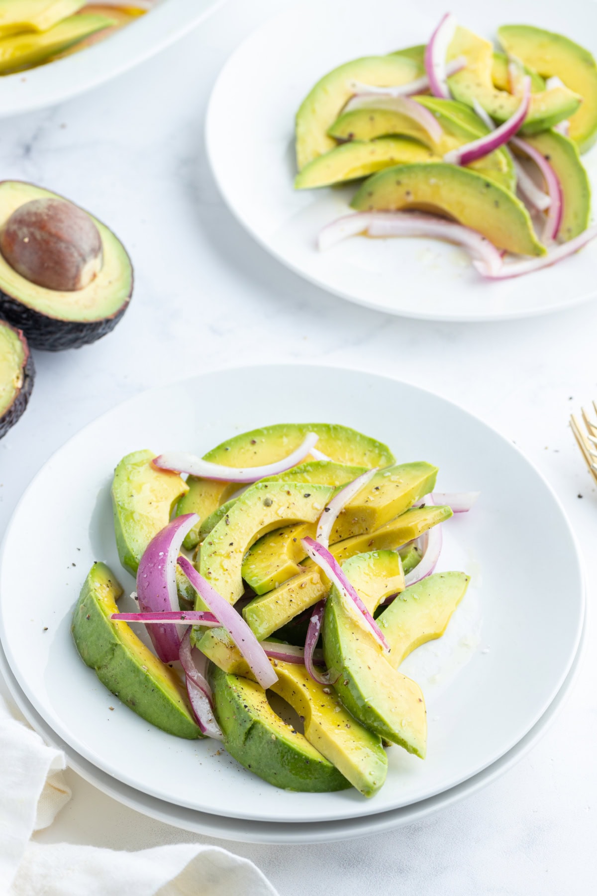 Avocado and Onion Salad recipe from RecipeGirl.com avocado and onion salad servings on plate