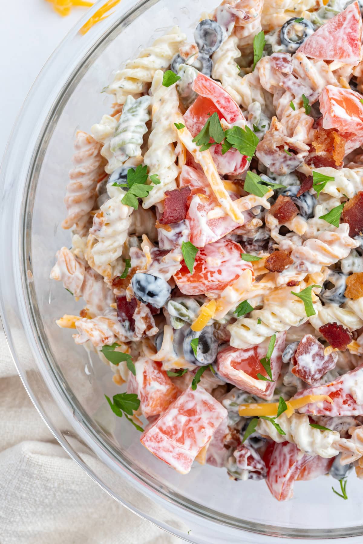 Bacon Ranch Pasta Salad recipe from RecipeGirl.com side view of bacon ranch pasta salad bowl