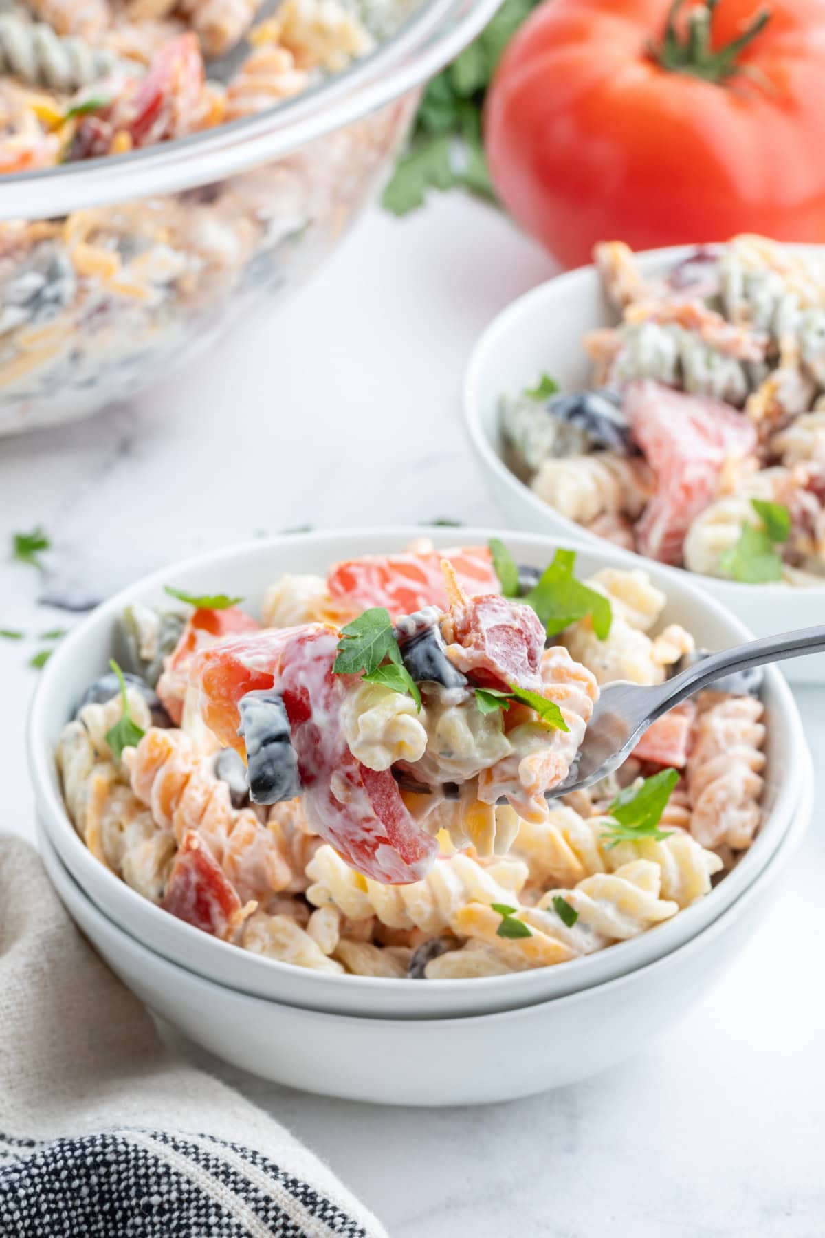 Bacon Ranch Pasta Salad recipe from RecipeGirl.com bacon ranch pasta salad in bowl with spoon