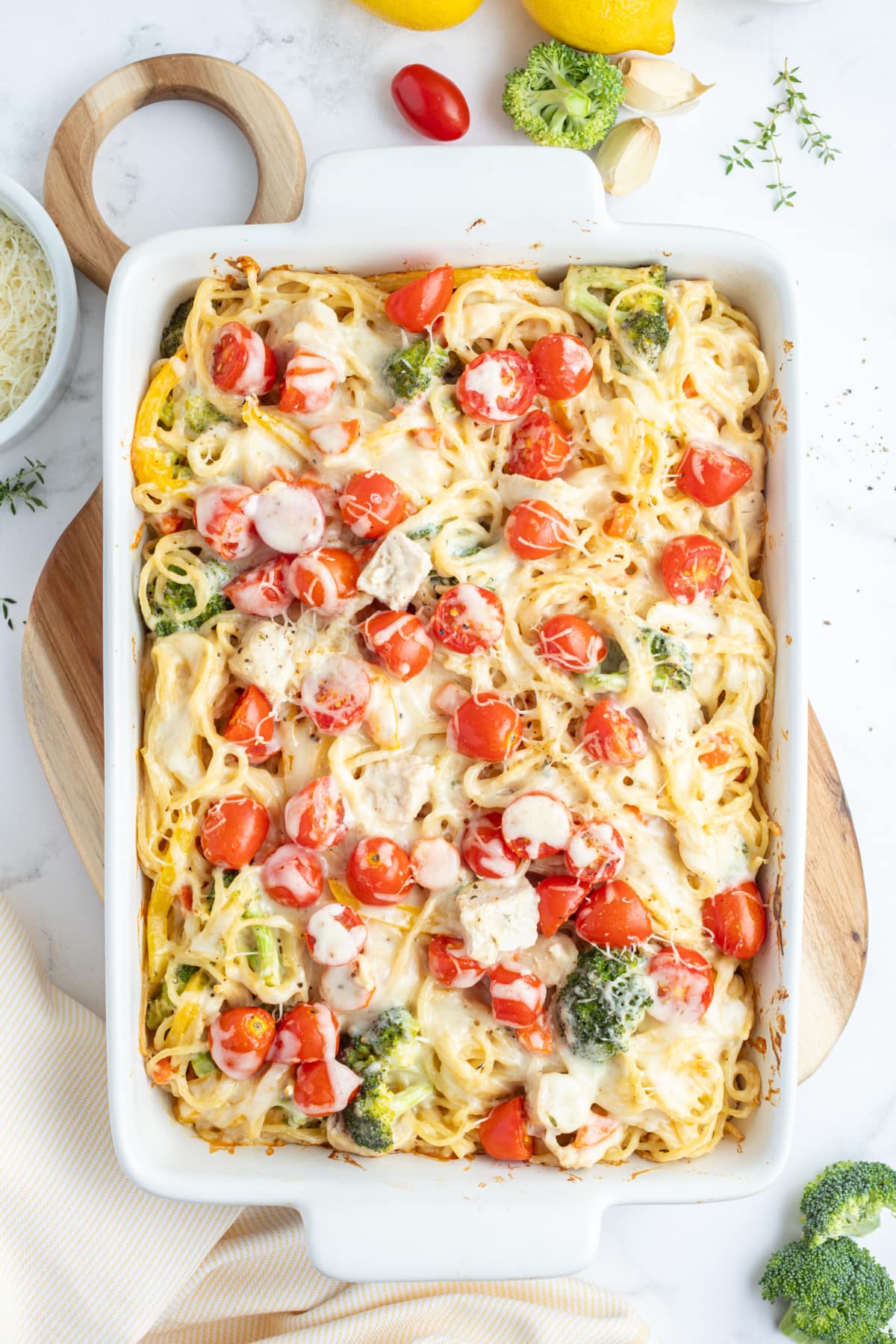 Baked Lemon Chicken Spaghetti Primavera recipe from RecipeGirl.com baked lemon chicken spaghetti primavera in a baking dish