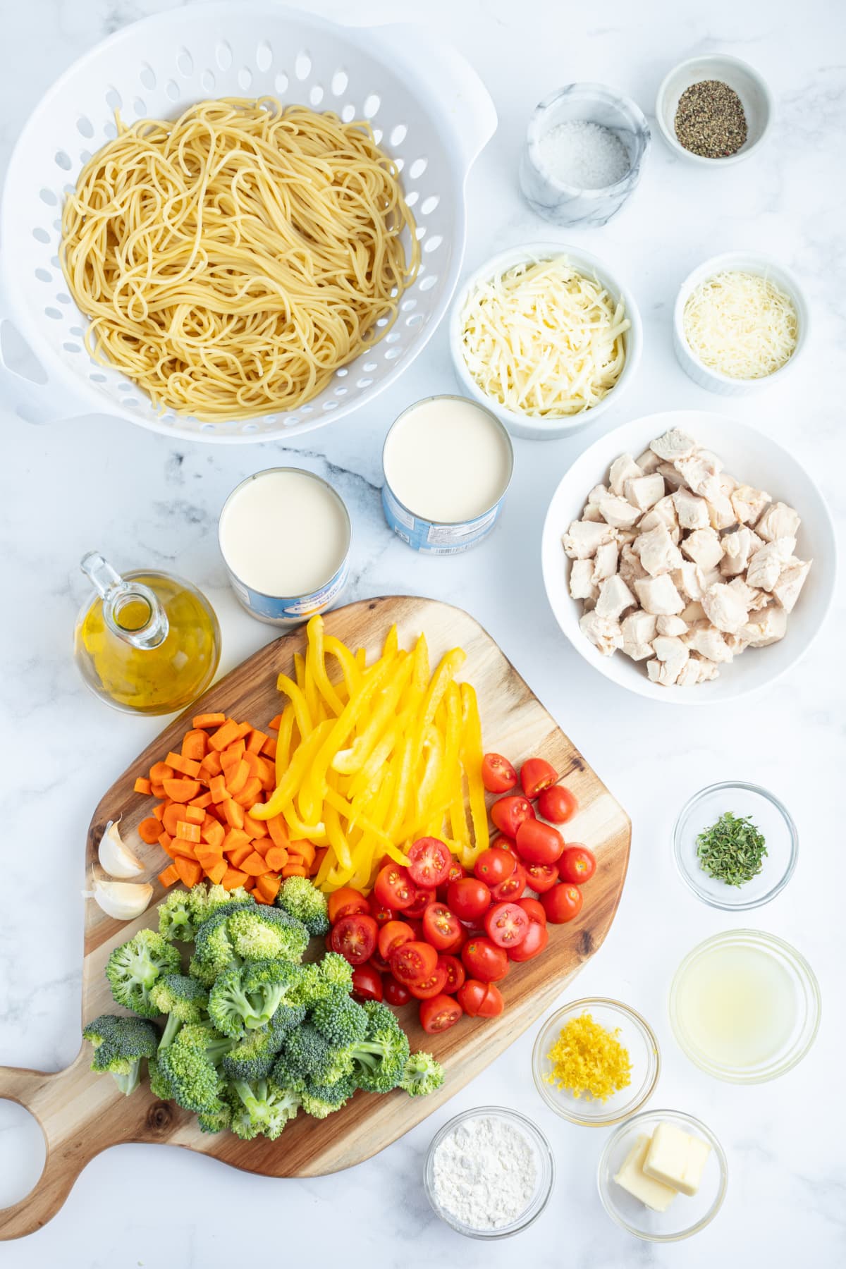 Baked Lemon Chicken Spaghetti Primavera recipe from RecipeGirl.com ingredients displayed for making baked lemon chicken spaghetti primavera