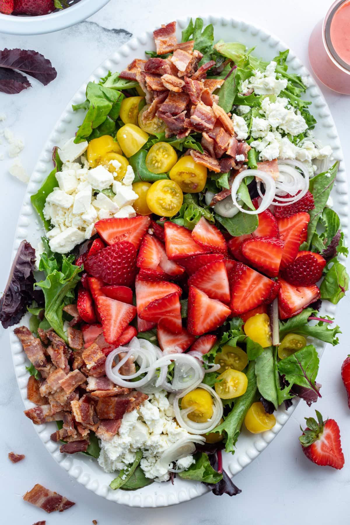 Berry Bacon and Tomato Salad with strawberry vinaigrette recipe from RecipeGirl.com berry bacon and tomato salad on platter