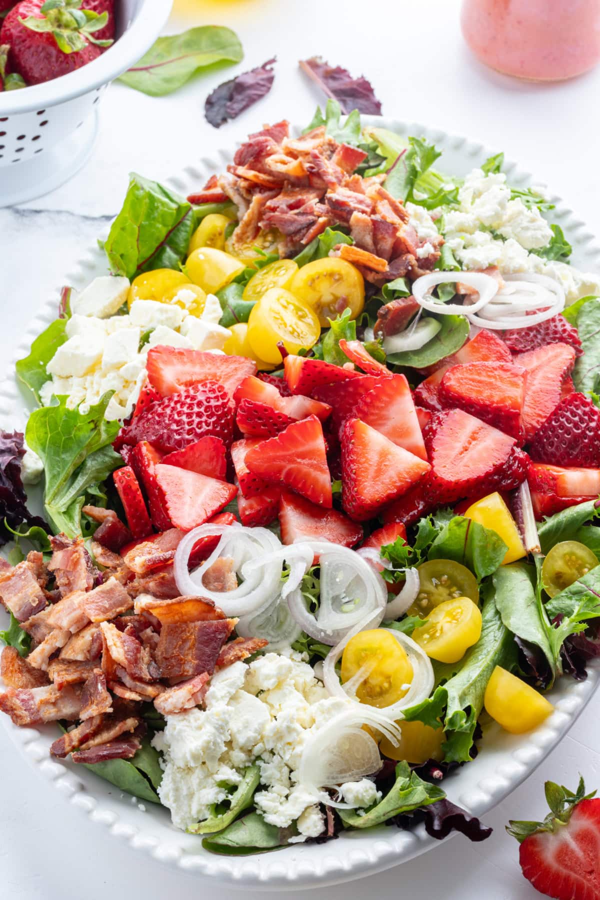 Berry Bacon and Tomato Salad with strawberry vinaigrette recipe from RecipeGirl.com berry bacon and tomato salad on big white plate