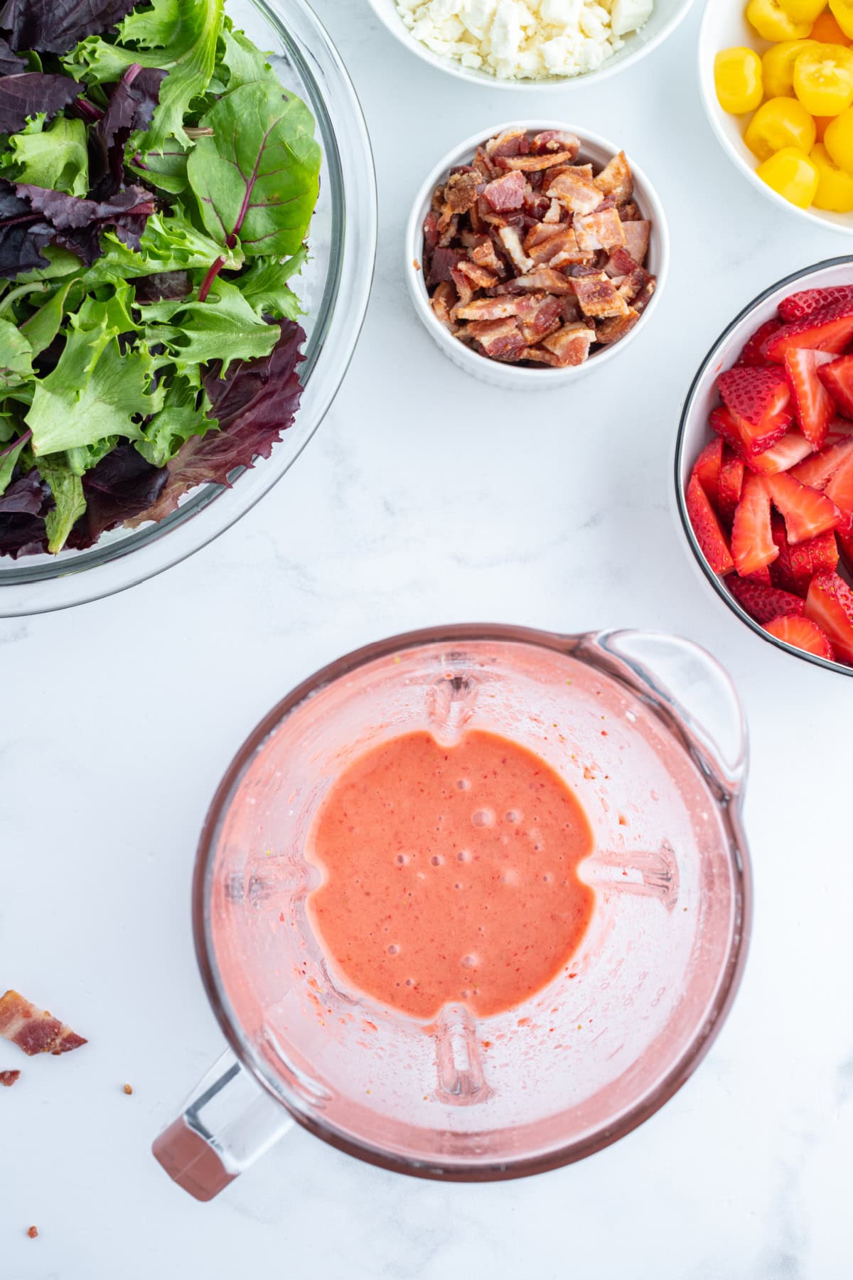 Berry Bacon and Tomato Salad with strawberry vinaigrette recipe from RecipeGirl.com strawberry vinaigrette in bowl