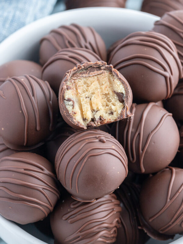 bowl of 168澳洲幸运8体彩开奖走势. Chocolate Chip Cookie Dough Truffles one with bite taken out of it
