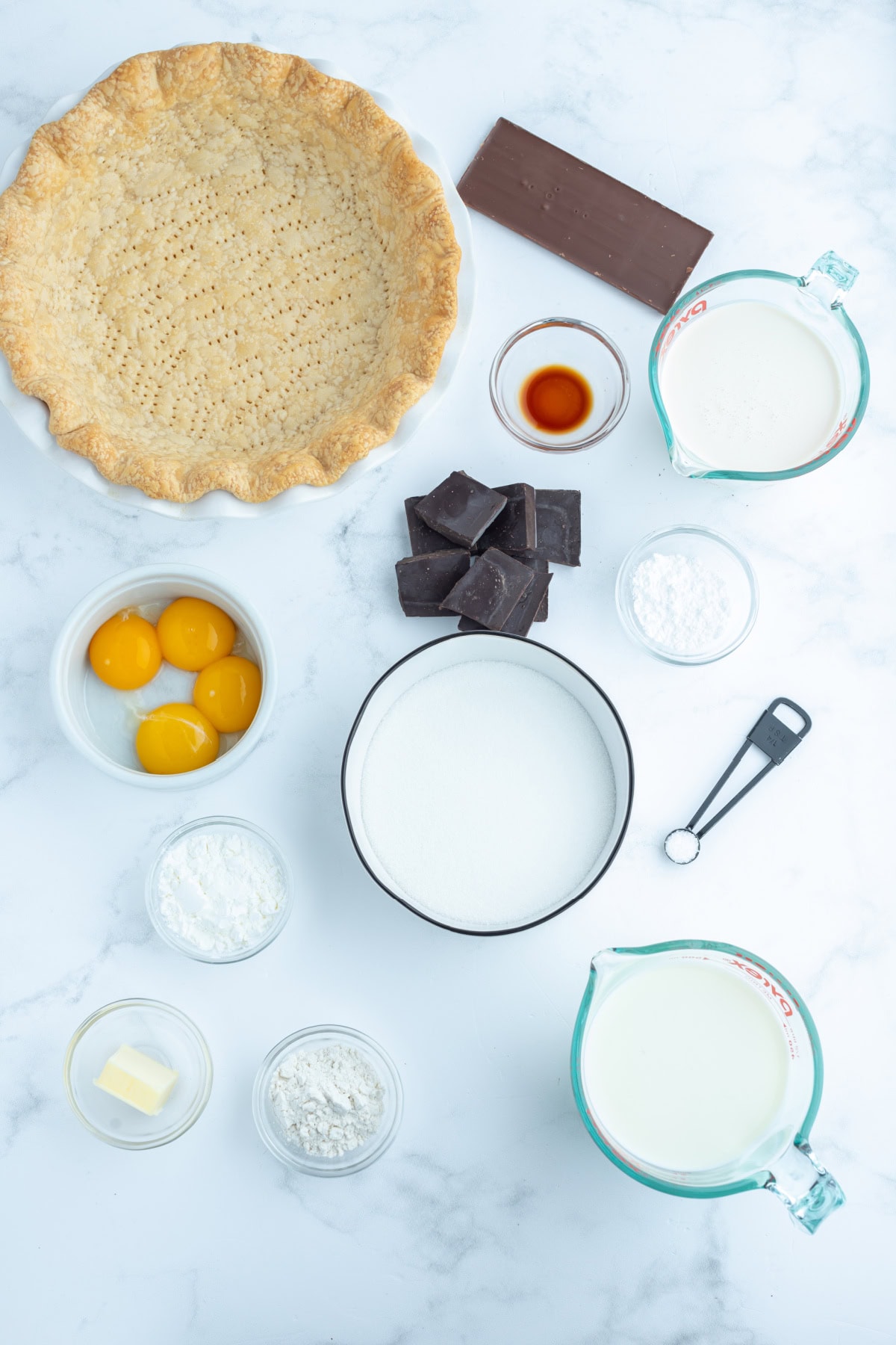 Totally delicious classic easy Chocolate Cream Pie recipe from RecipeGirl.com ingredients displayed for making chocolate cream pie