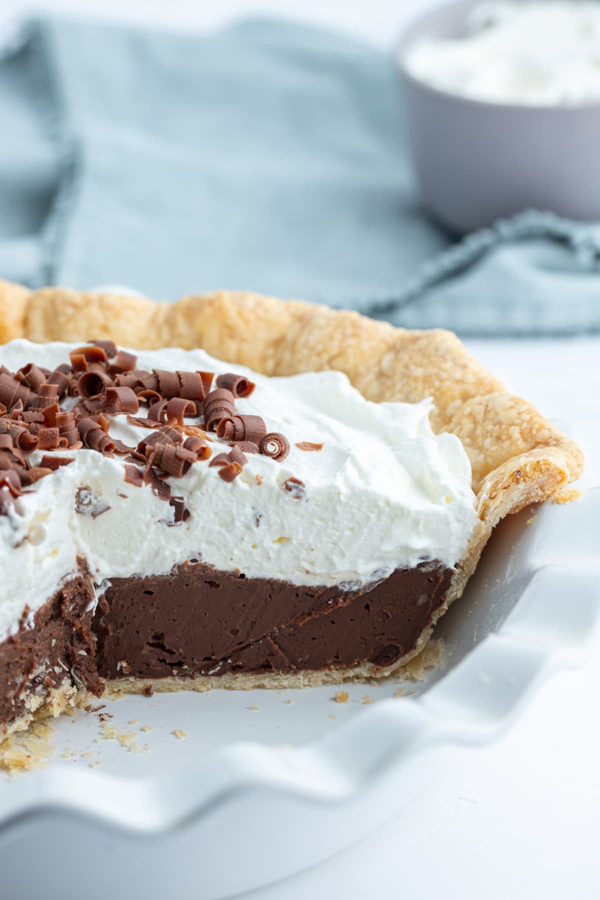 Totally delicious classic easy Chocolate Cream Pie recipe from RecipeGirl.com chocolate cream pie with large slice taken out of it