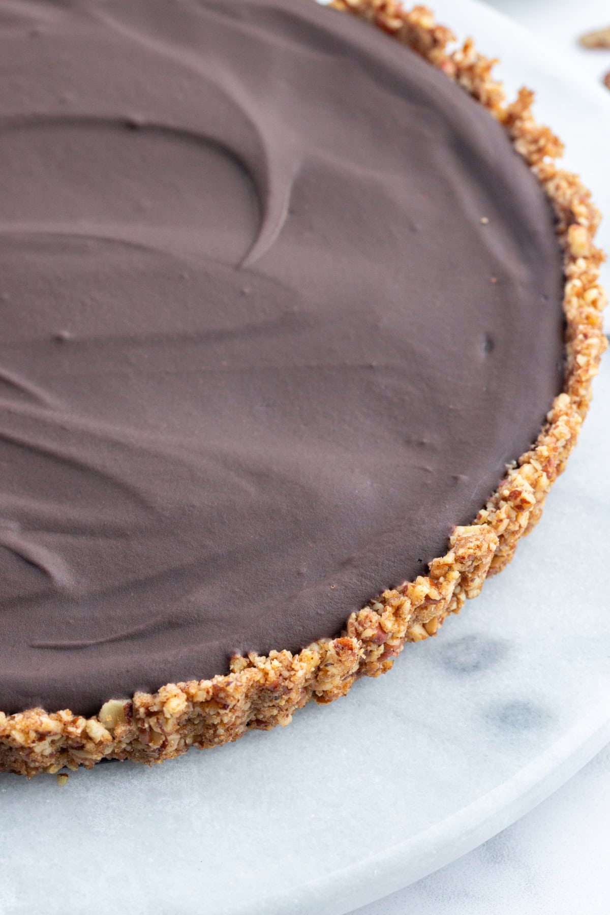 Chocolate Pecan Tart with Caramel Sauce recipe from RecipeGirl.com side shot of chocolate pecan tart