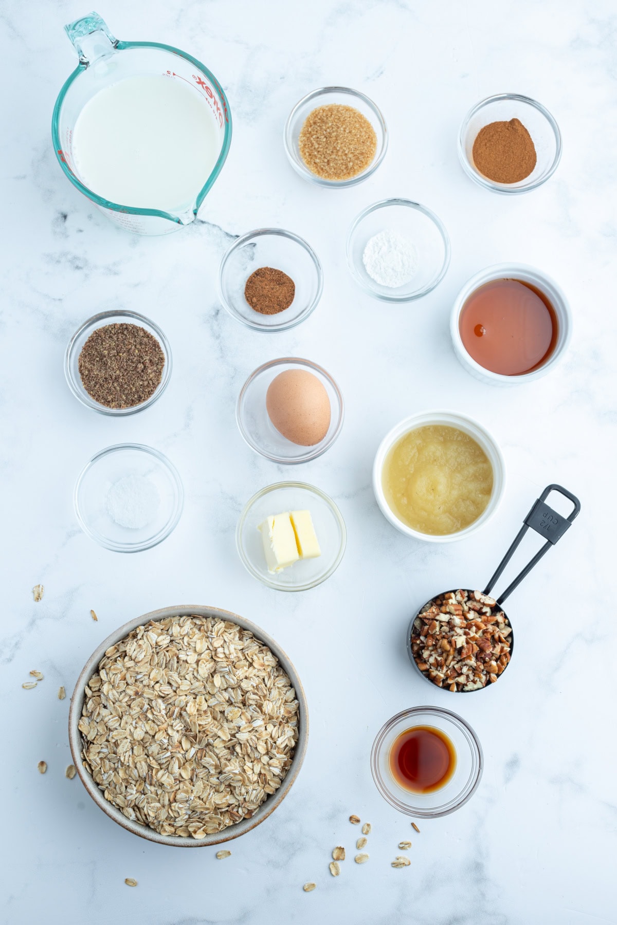 Cinnamon Roll Baked Oatmeal recipe from RecipeGirl.com ingredients displayed for making cinnamon roll baked oatmeal