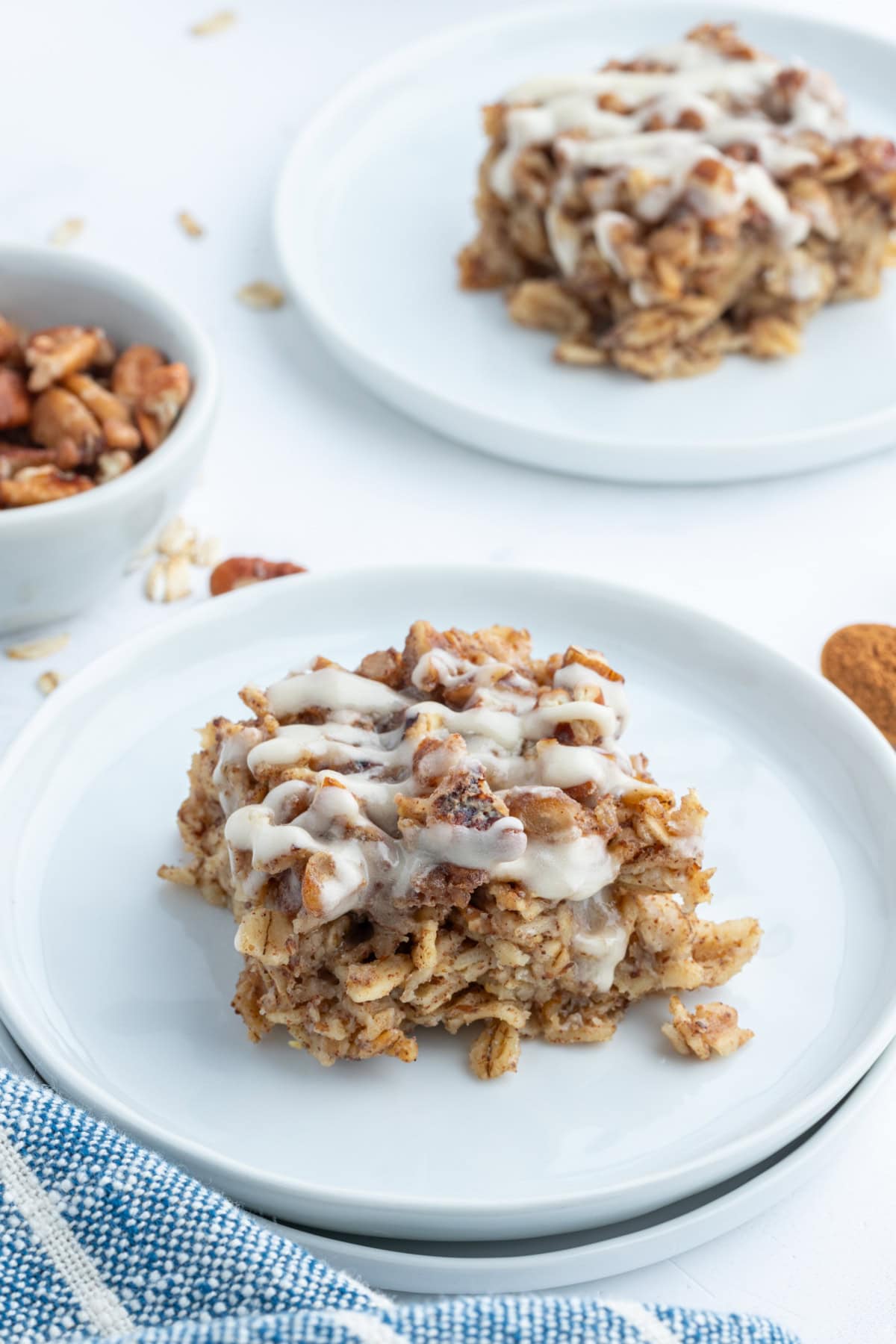 Cinnamon Roll Baked Oatmeal recipe from RecipeGirl.com serving of cinnamon roll baked oatmeal on plate