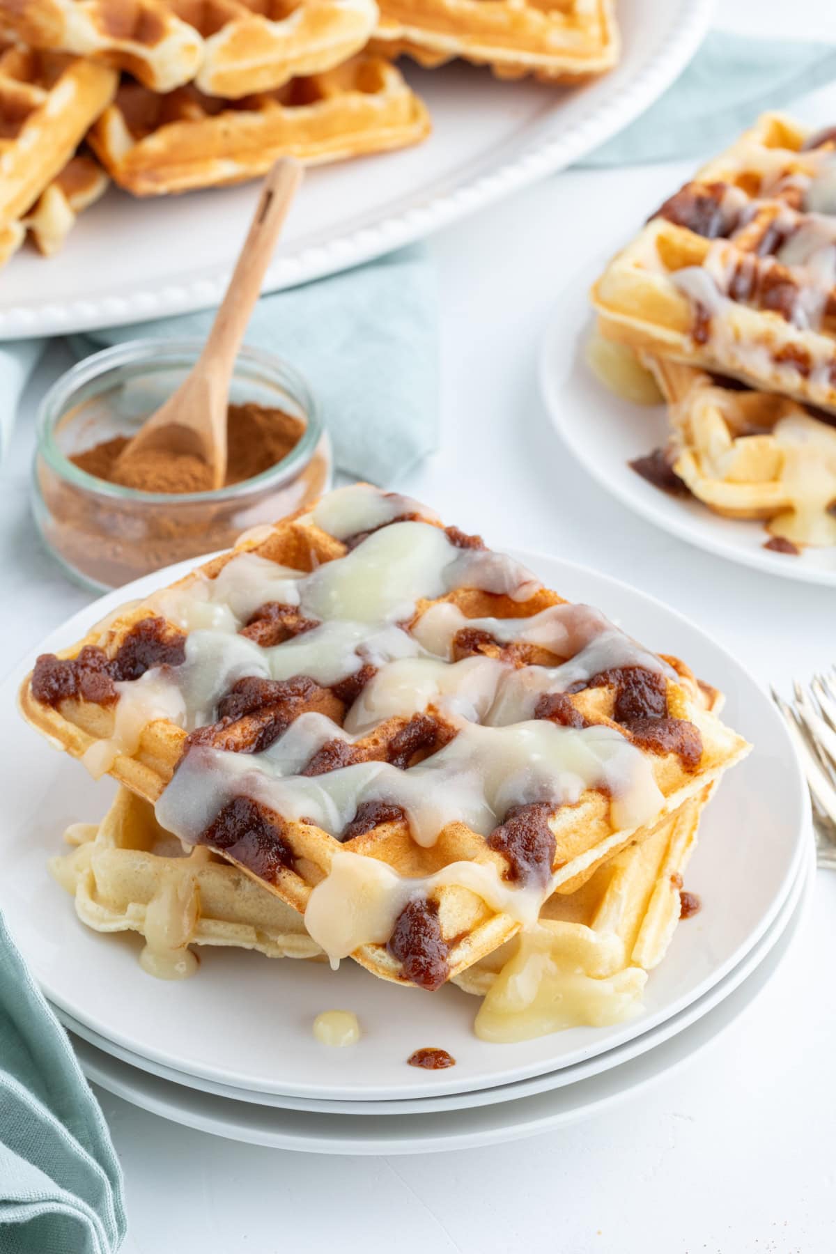 Cinnamon Roll Waffles recipe from RecipeGirl.com cinnamon roll waffles on plate