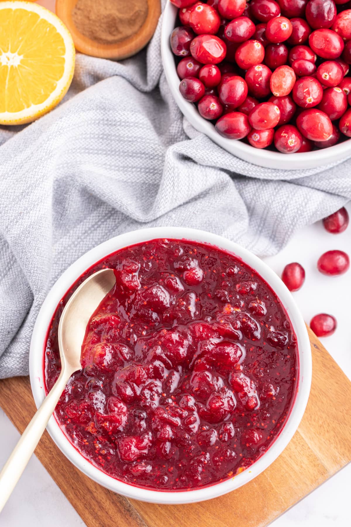 Classic Cranberry Sauce recipe from RecipeGirl.com bowl of classic cranberry sauce with spoon