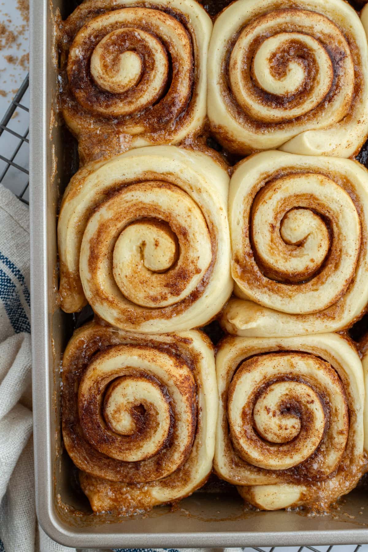 Copycat Cinnabon Cinnamon Rolls recipe from RecipeGirl.com cinnamon rolls in pan no icing