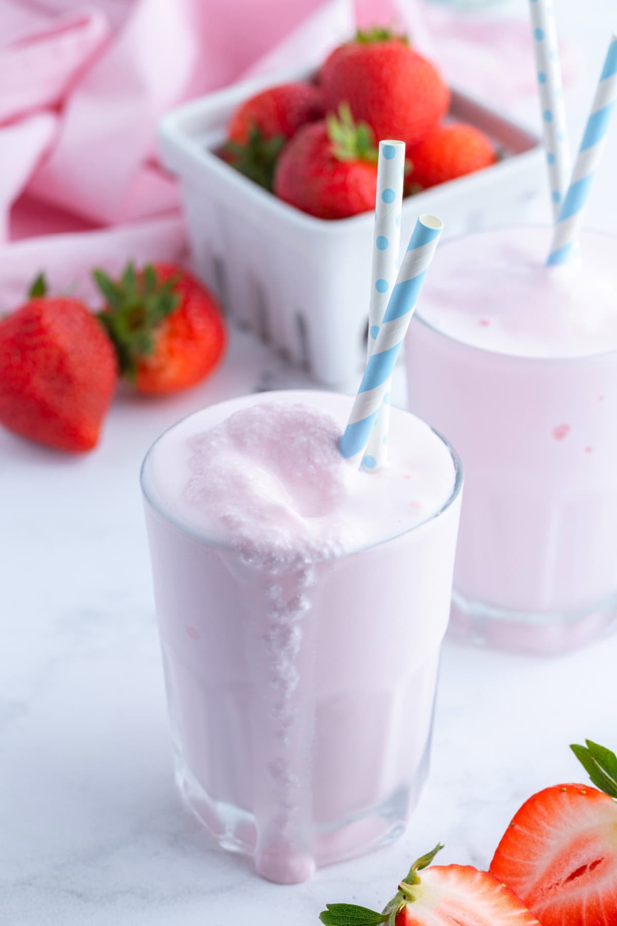 Copycat Wendy's Strawberry Frosty recipe from RecipeGirl.com copycat wendy's strawberry frosty in glass with straw
