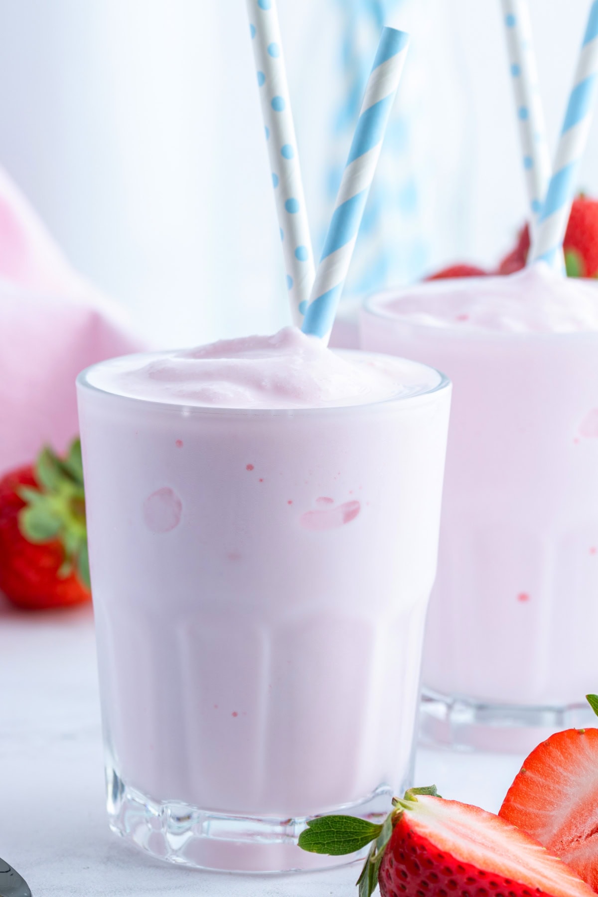 Copycat Wendy's Strawberry Frosty recipe from RecipeGirl.com copycat wendy's strawberry frosty in glass with straws