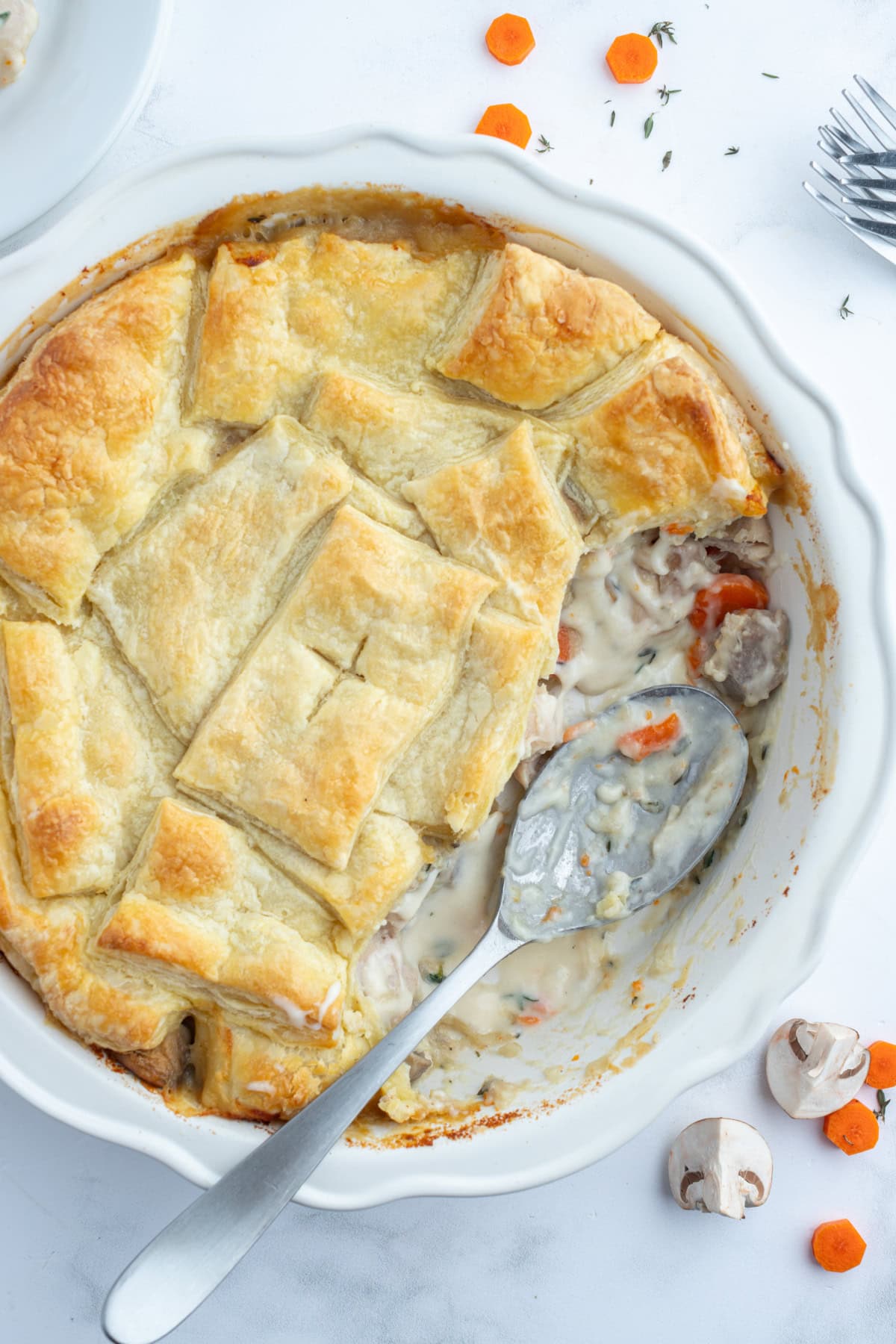 Coq au Vin Pot Pie recipe from RecipeGirl.com : Fun way to eat this popular French comfort food recipe, and a unique version of the classic chicken pot pie. coq au vin pot pie with spoonful taken out