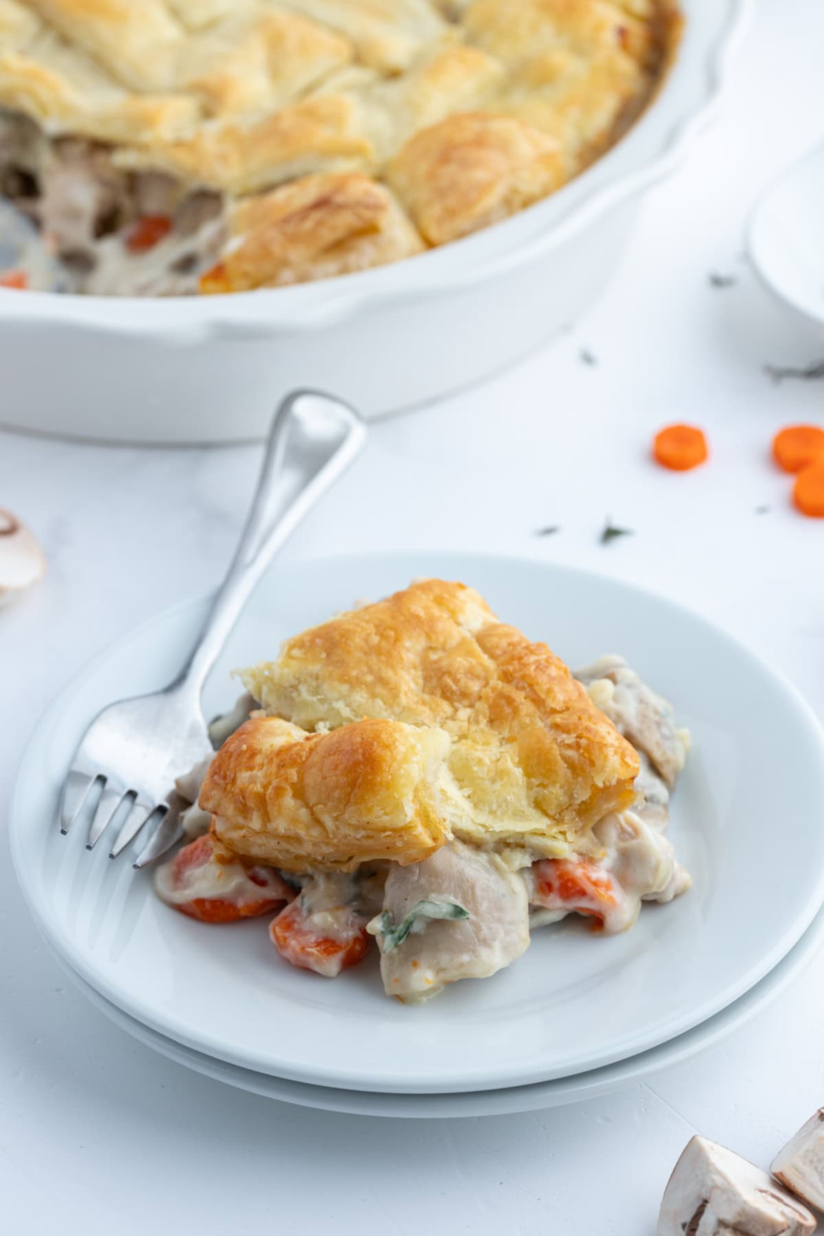 Coq au Vin Pot Pie recipe from RecipeGirl.com : Fun way to eat this popular French comfort food recipe, and a unique version of the classic chicken pot pie. serving of coq au vin pot pie on plate