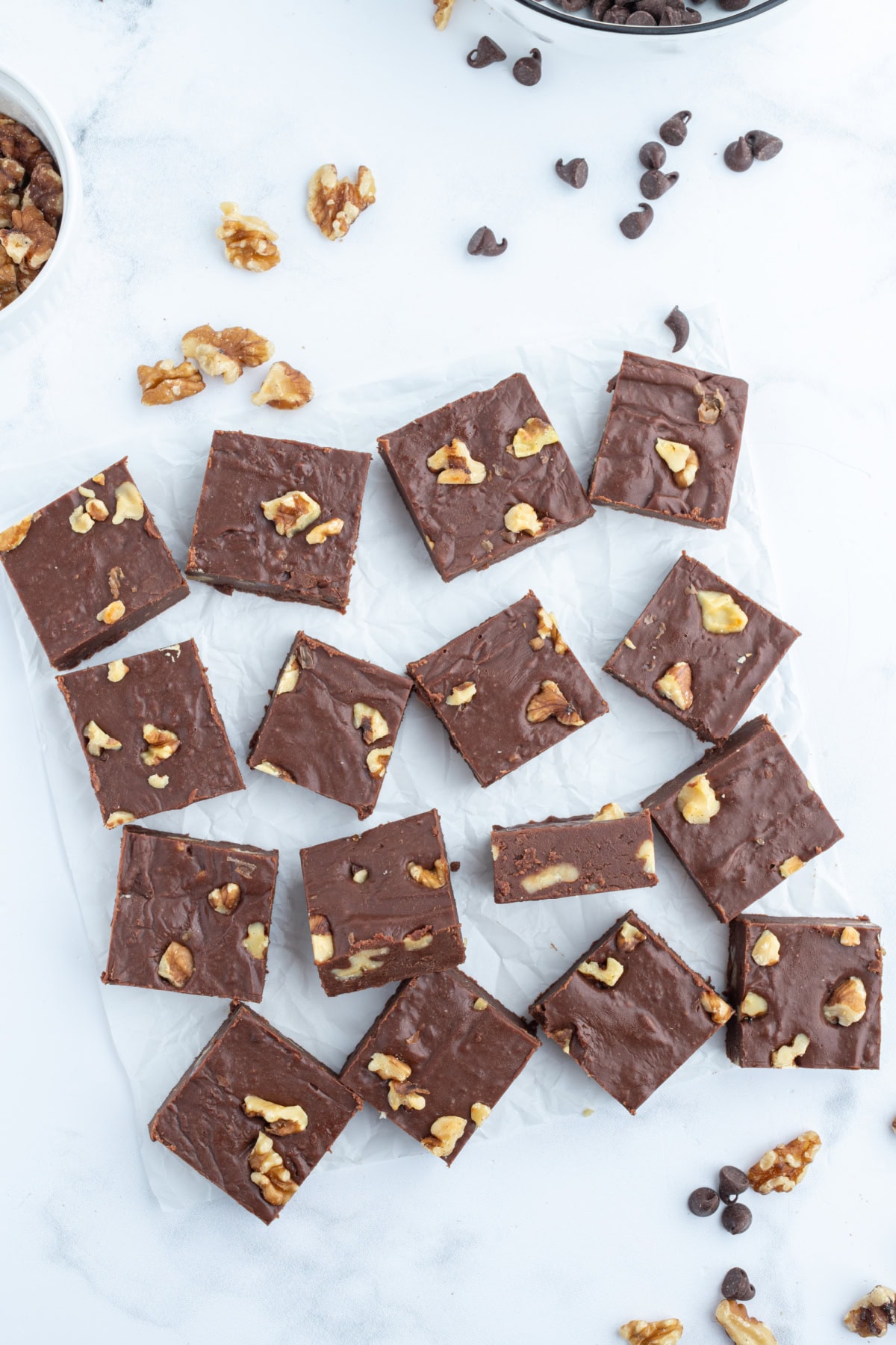 Creamy Chocolate Walnut Fudge recipe from RecipeGirl.com creamy chocolate walnut fudge cut into pieces