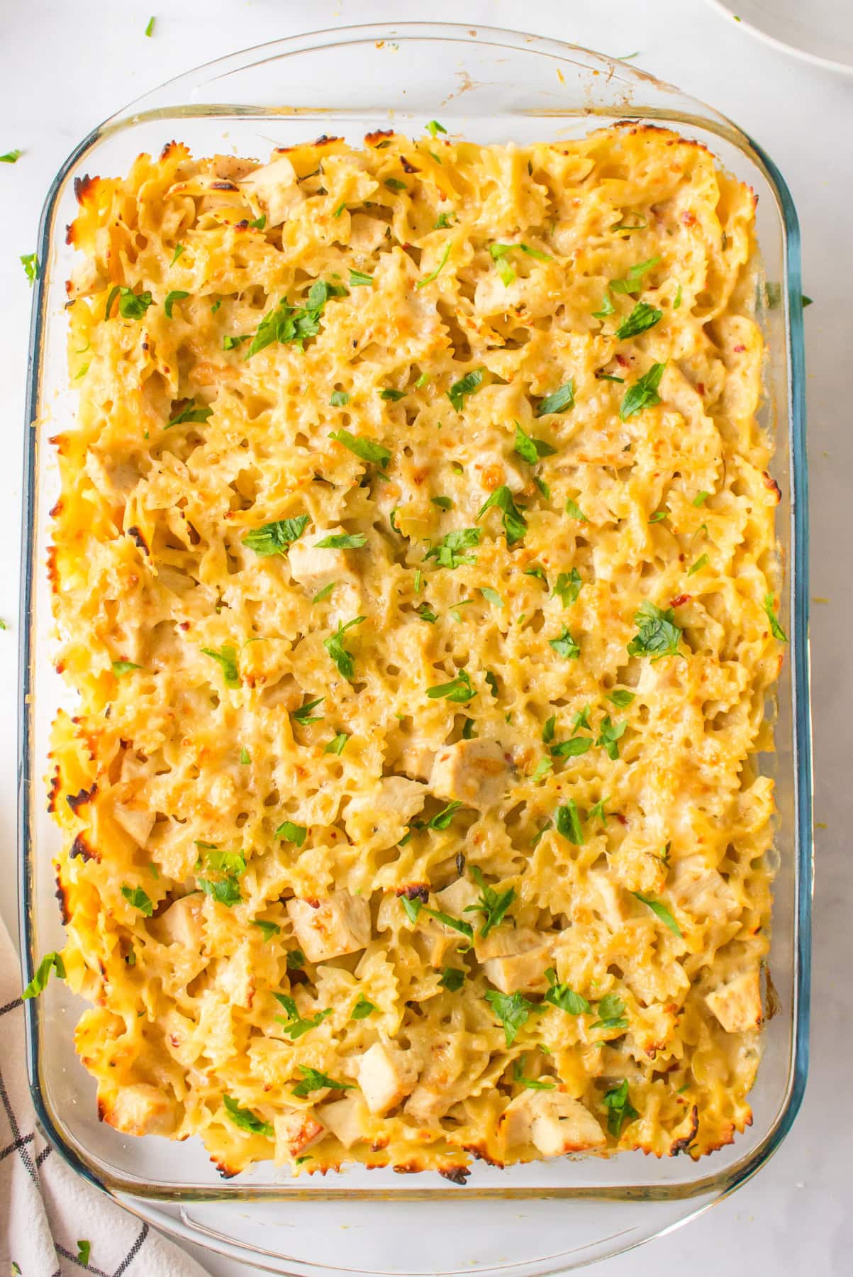 Creamy Lemon Chicken Pasta recipe from RecipeGirl.com creamy lemon chicken pasta in a casserole dish