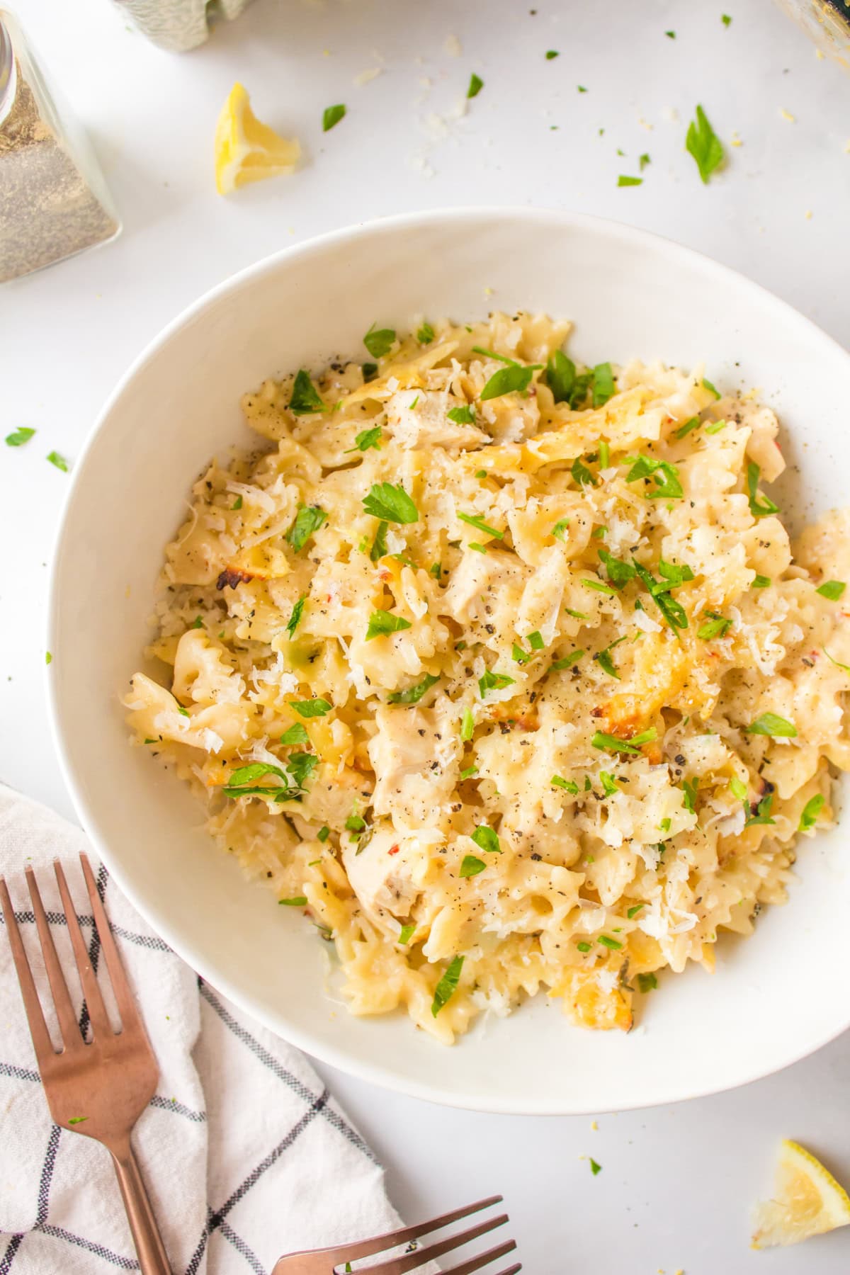Creamy Lemon Chicken Pasta recipe from RecipeGirl.com serving of creamy lemon chicken pasta in bowl