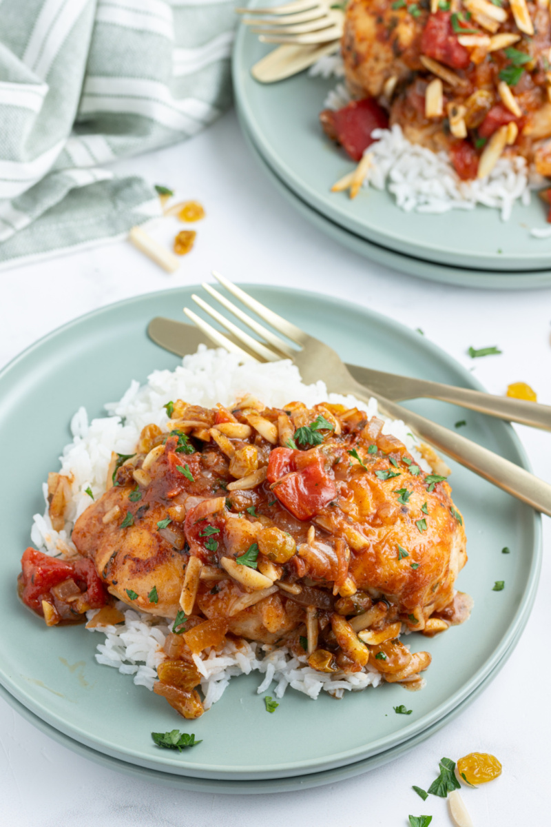Drunken Chicken recipe from RecipeGirl.com drunken chicken serving on plate over rice