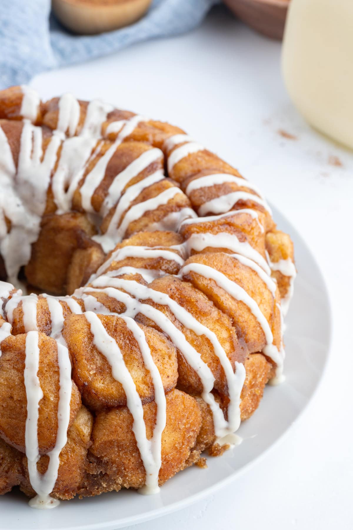 Eggnog Monkey Bread recipe from RecipeGirl.com half view of eggnog monkey bread on plate