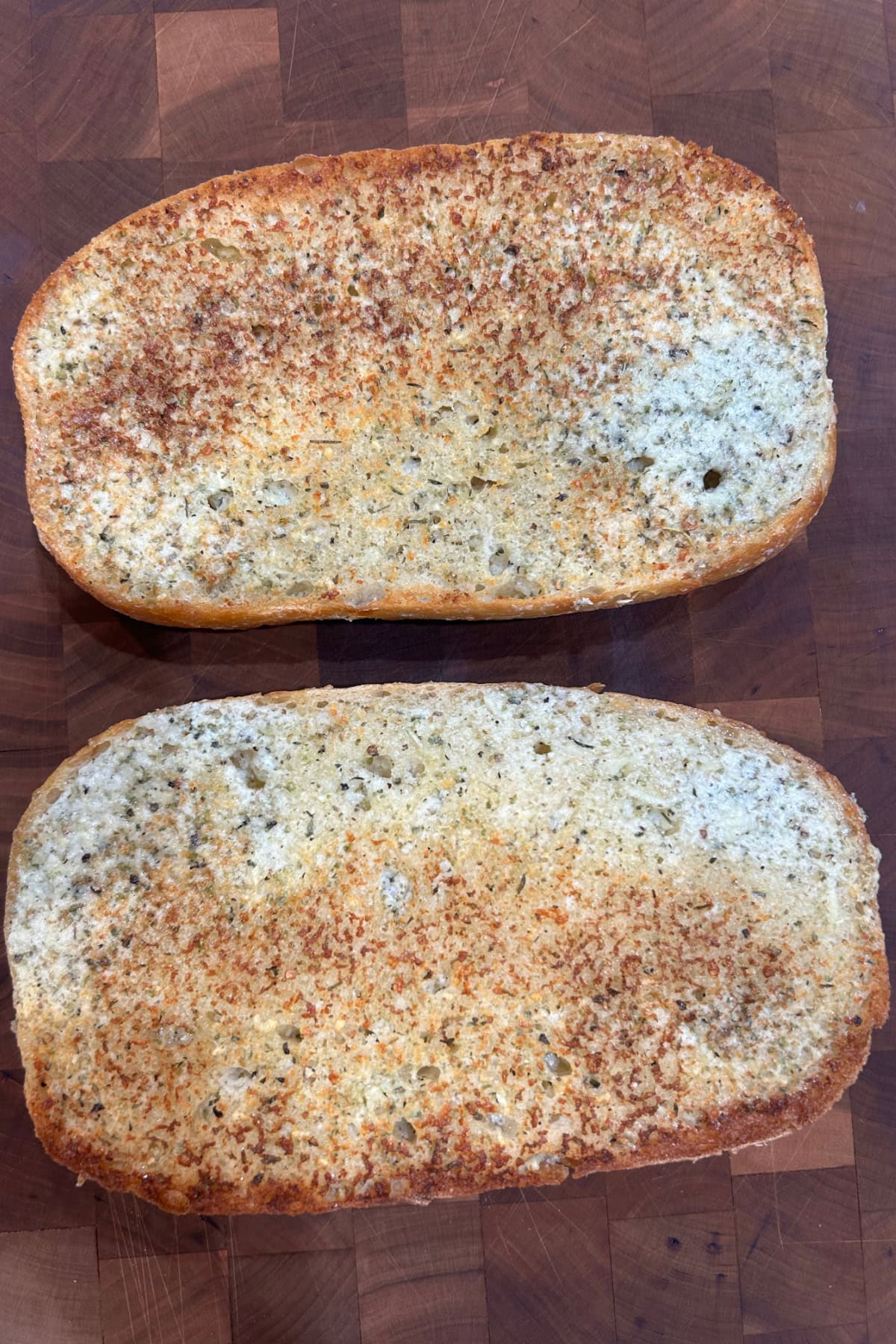 Garlic Bread Spread recipe from RecipeGirl.com two pieces of garlic bread