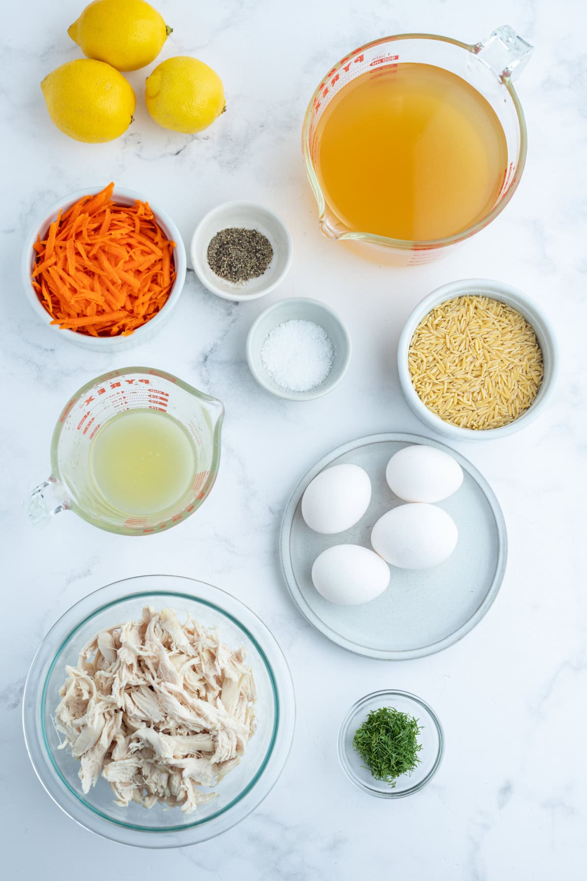 Greek Orzo and Chicken Soup recipe from RecipeGirl.com ingredients displayed for making greek orzo and chicken soup