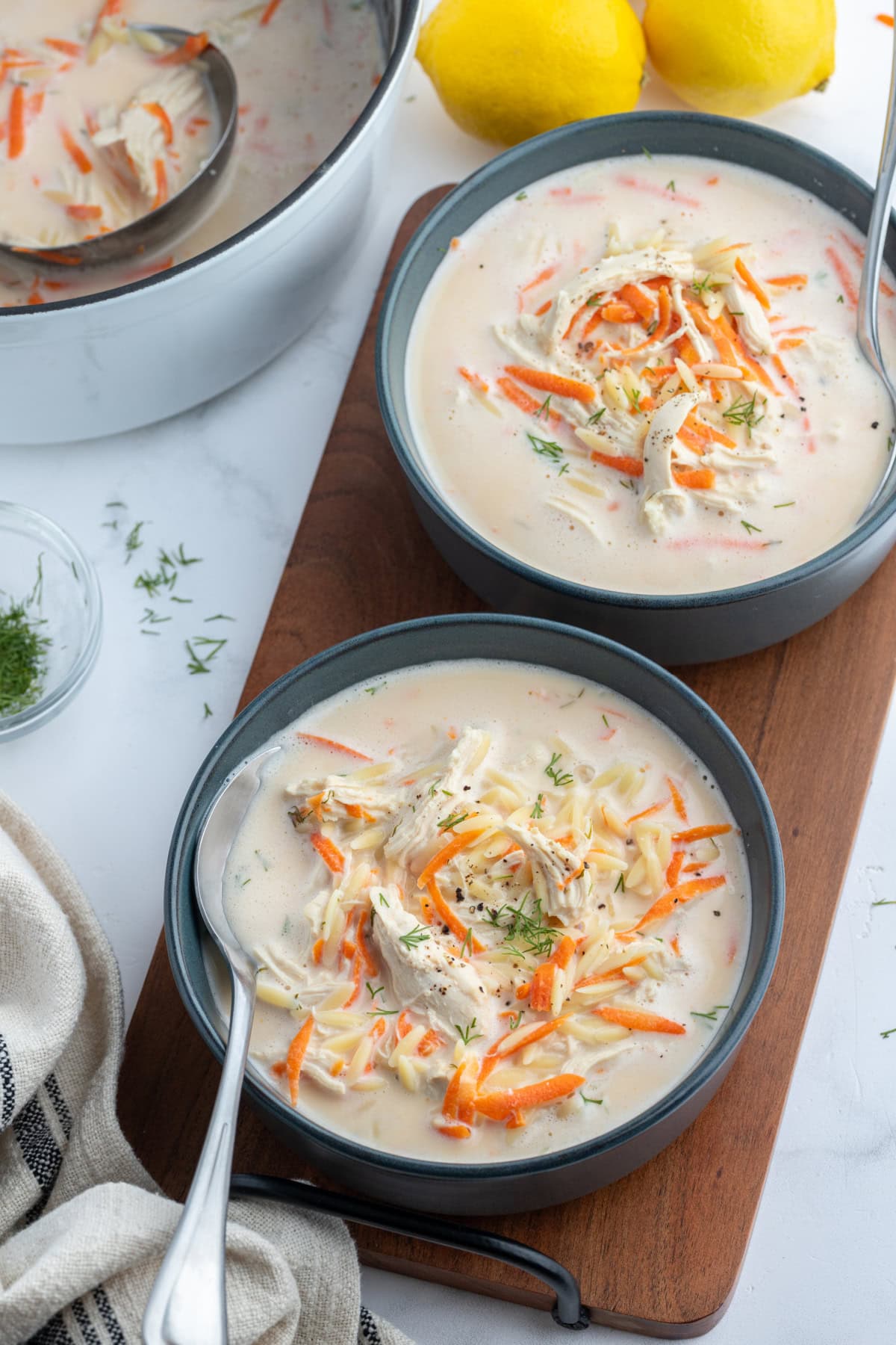 Greek Orzo and Chicken Soup recipe from RecipeGirl.com overhead shot of greek orzo and chicken soup in two bowls