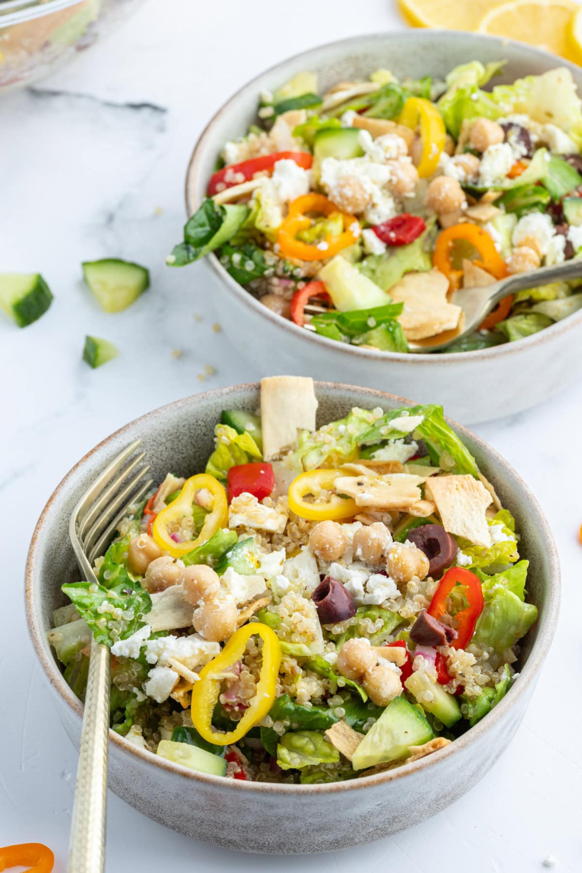 Greek Quinoa Chopped Salad recipe from RecipeGirl.com greek quinoa chopped salad in two bowls