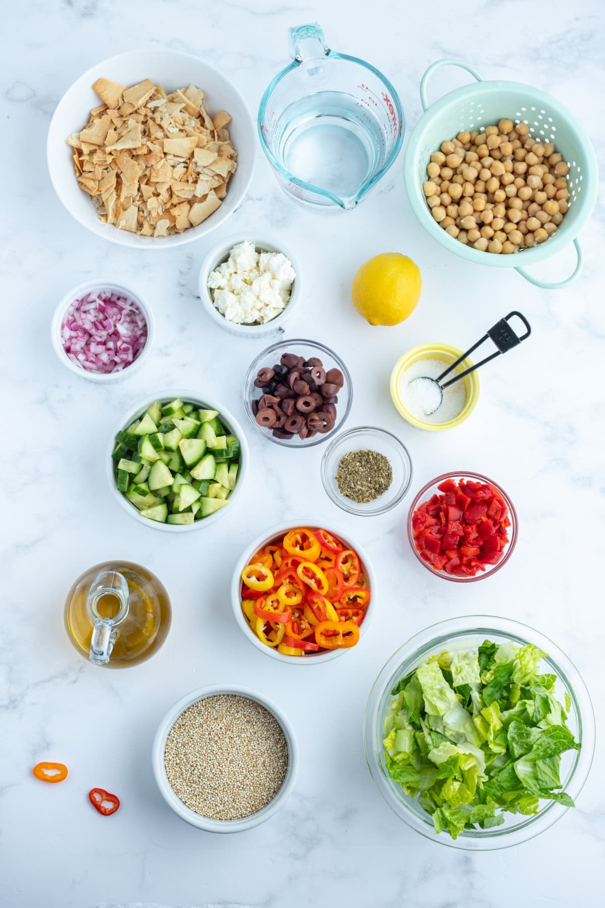 Greek Quinoa Chopped Salad recipe from RecipeGirl.com ingredients displayed for making greek quinoa chopped salad