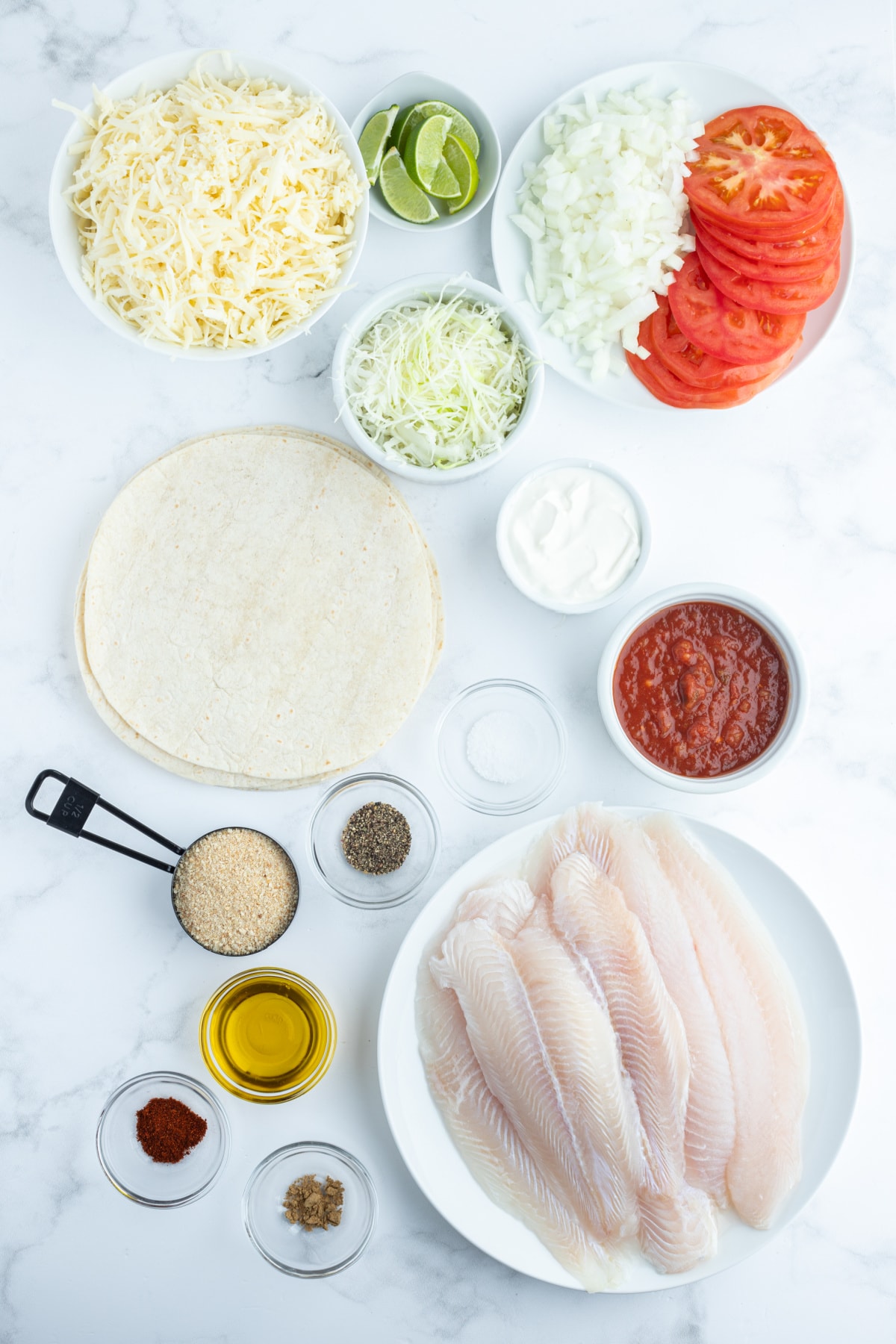 Inside Out Fish Tacos, otherwise known as Fish Taco Casserole recipe from RecipeGirl.com ingredients displayed for making inside out fish tacos
