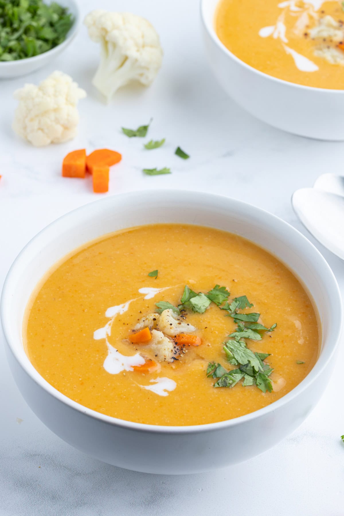Instant Pot Cauliflower and Sweet Potato Soup recipe from RecipeGirl.com bowl of instant pot cauliflower and sweet potato soup