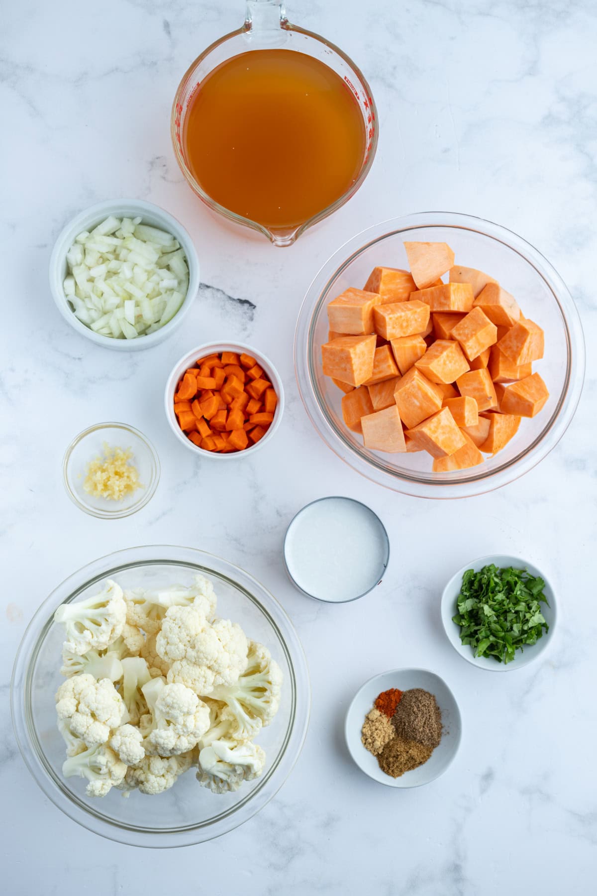 Instant Pot Cauliflower and Sweet Potato Soup recipe from RecipeGirl.com ingredients displayed for making instant pot cauliflower and sweet potato soup