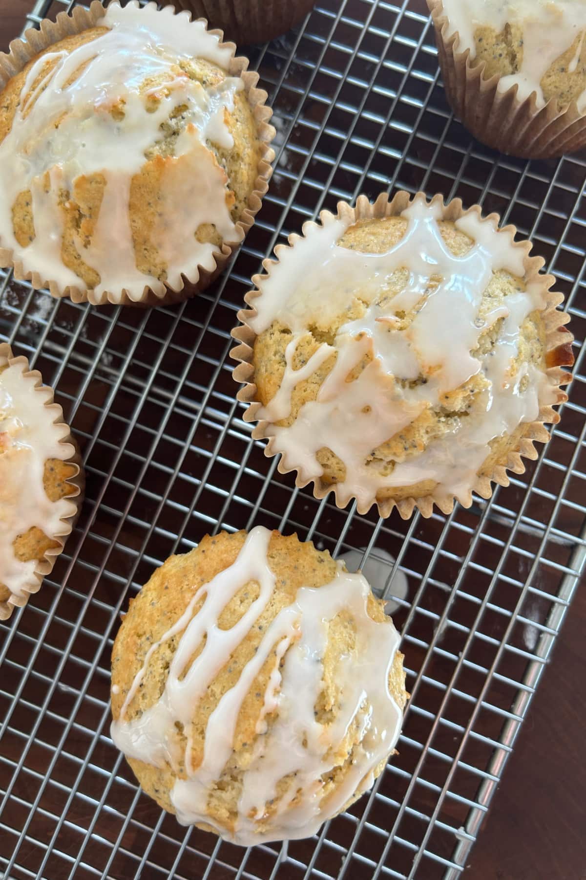 Lemon Poppy Seed Muffins recipe from RecipeGirl.com overhead shot of lemon poppy seed muffins on cooling rack