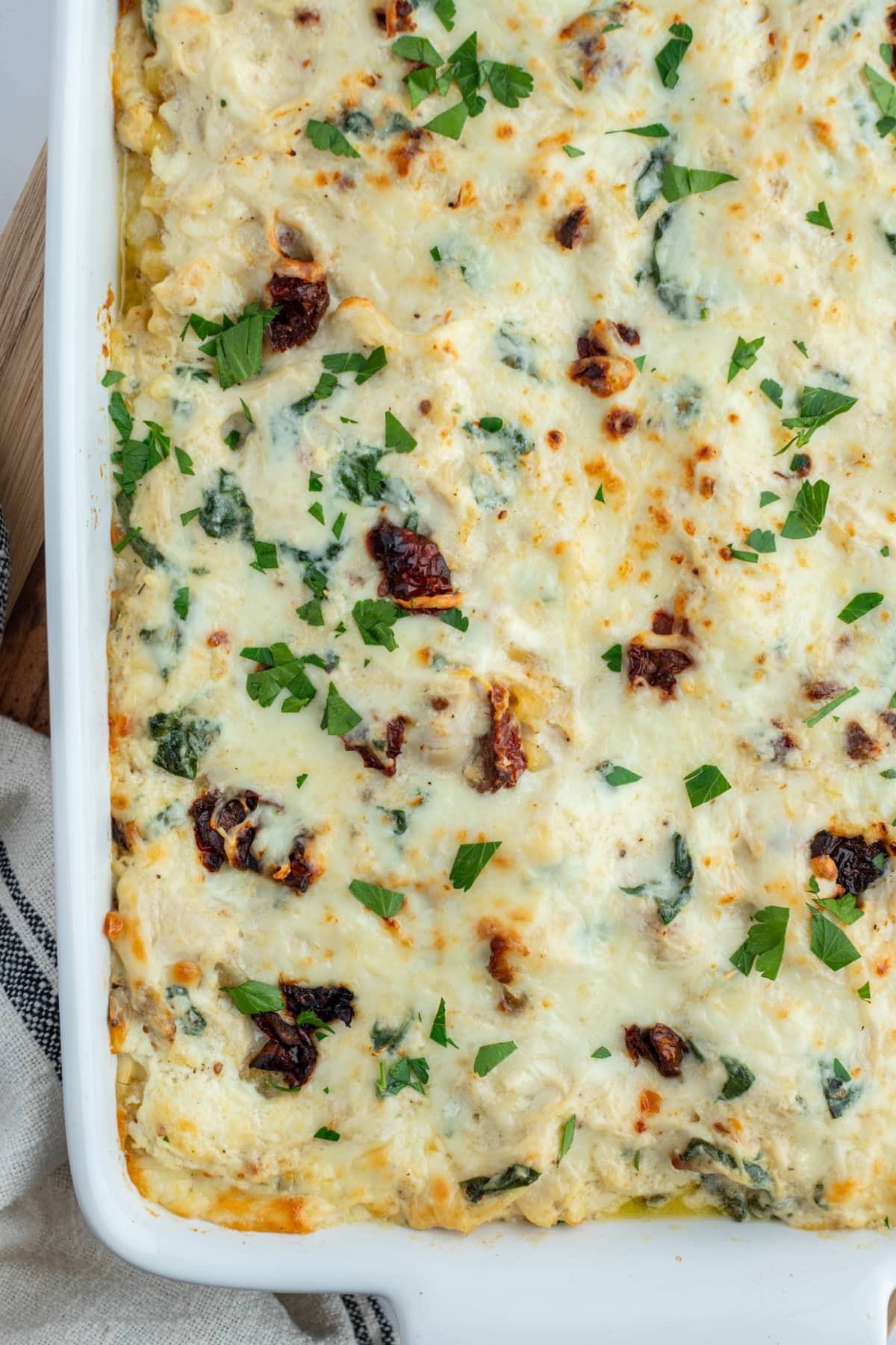 Marry Me Chicken Lasagna recipe from RecipeGirl.com marry me chicken lasagna in baking dish