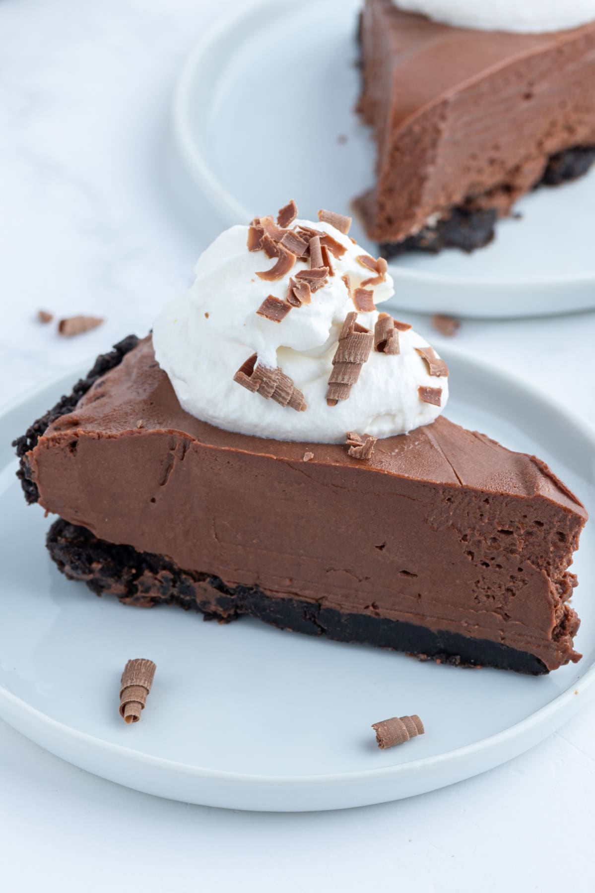 No Bake Easy Chocolate Truffle Pie recipe from RecipeGirl.com slice of no bake easy chocolate truffle pie on plate