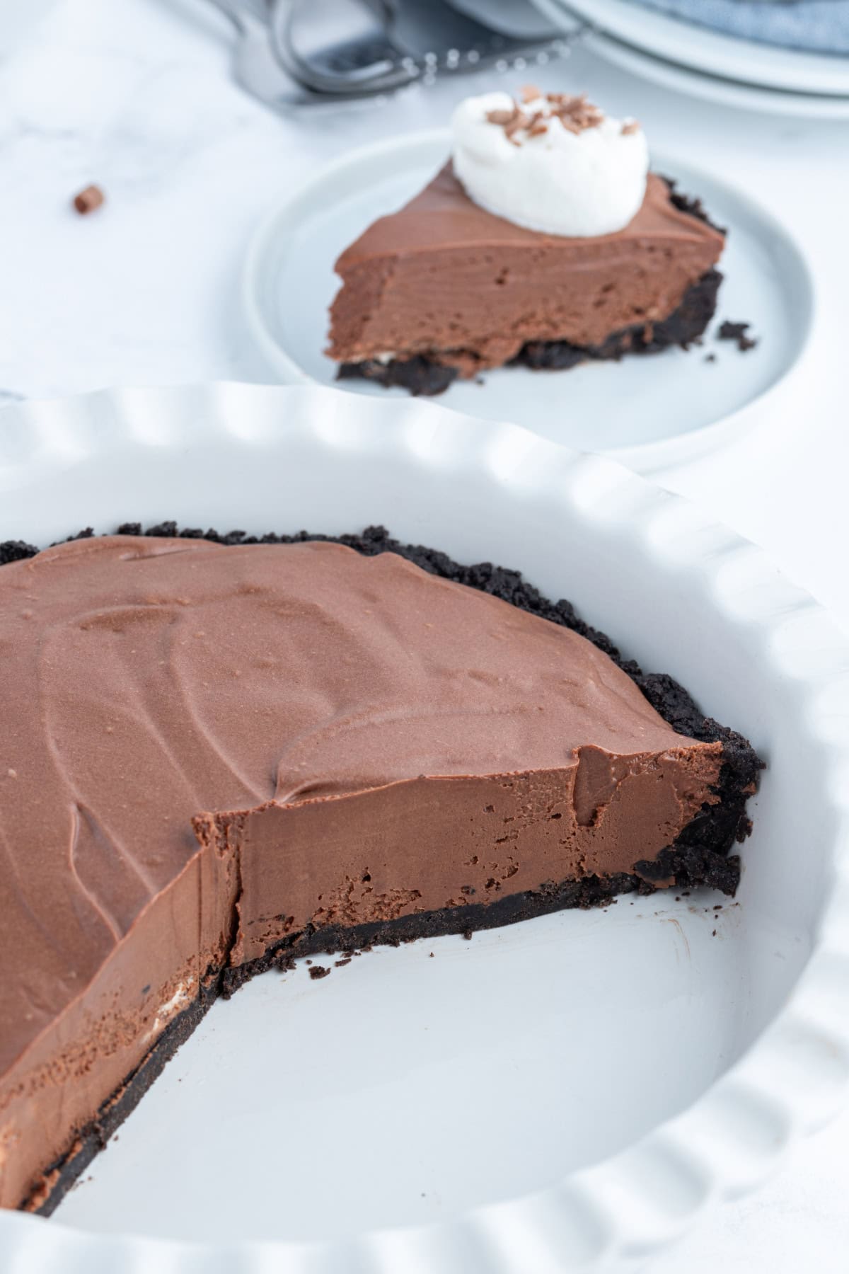 No Bake Easy Chocolate Truffle Pie recipe from RecipeGirl.com easy chocolate truffle pie with large slice taken out