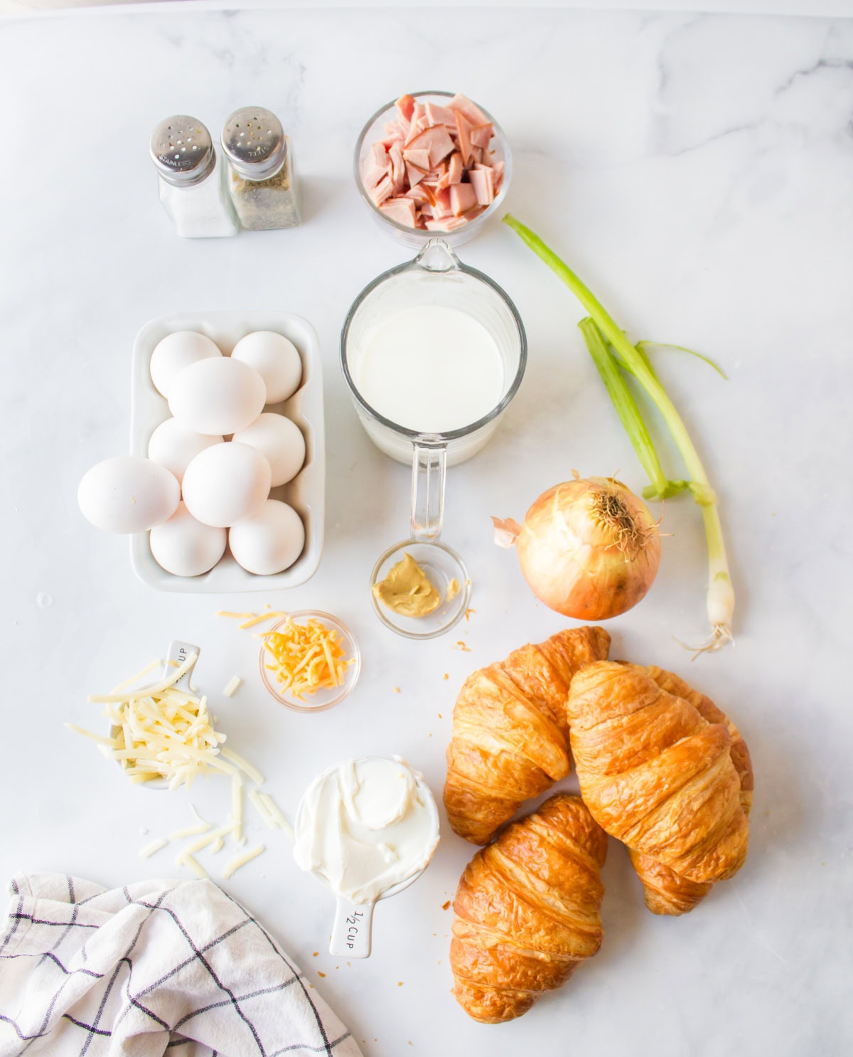 Overnight Croissant Ham and Cheese Breakfast Casserole recipe from RecipeGirl.com ingredients displayed for making overnight croissant ham and cheese breakfast casserole