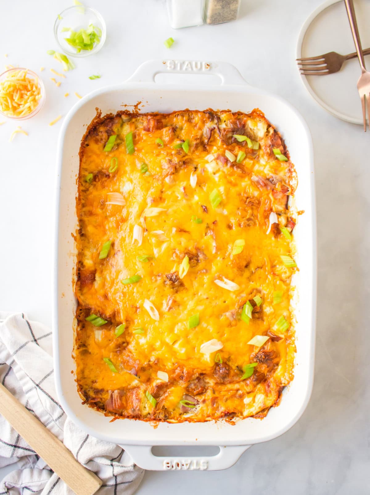 Overnight Croissant Ham and Cheese Breakfast Casserole recipe from RecipeGirl.com casserole dish of overnight croissant ham and cheese breakfast casserole