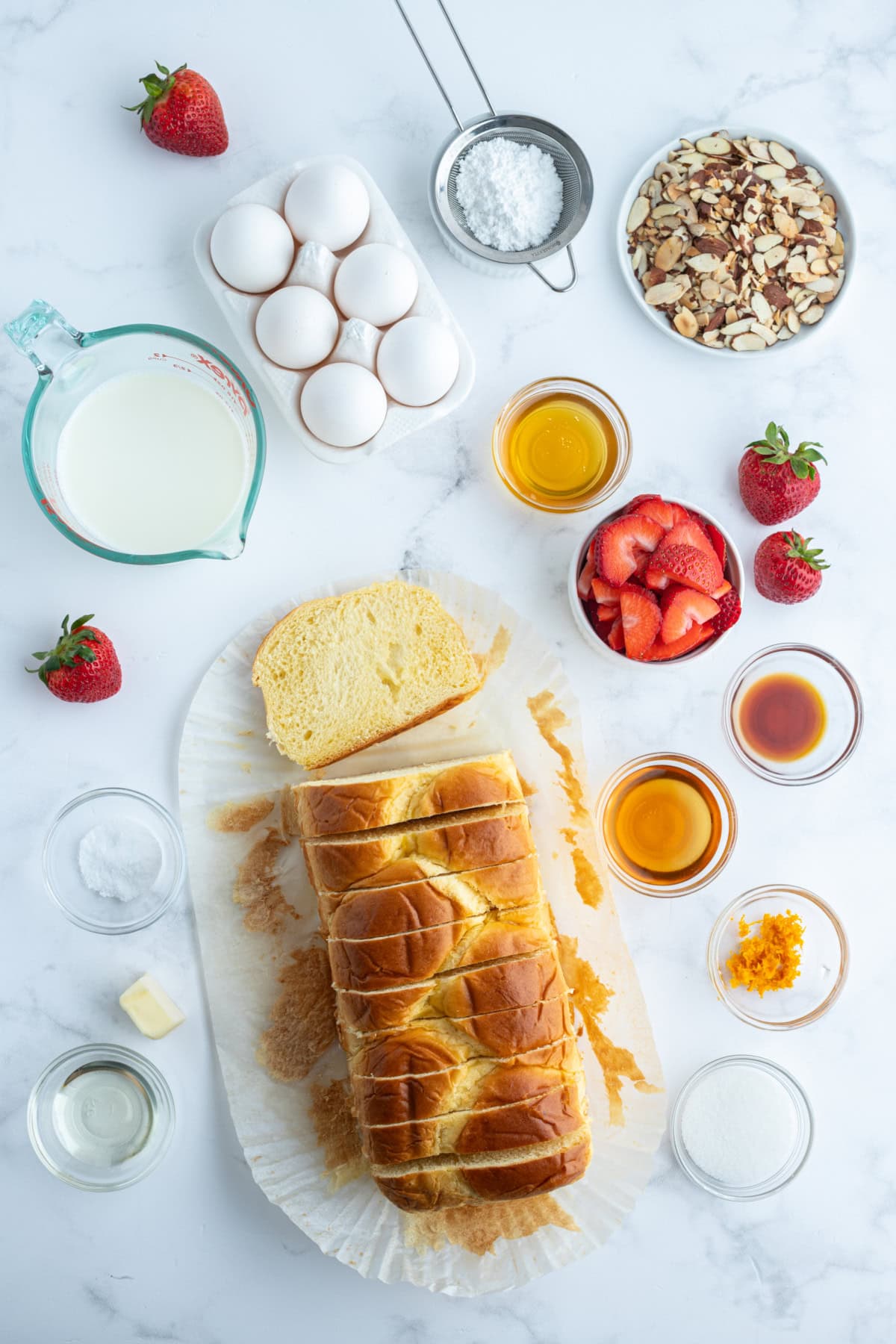 Pain Perdu is a traditional French toast. This is Ina Garten's Barefoot in Paris recipe with strawberries, almonds and Grand Marnier. ingredients displayed for making pain perdu