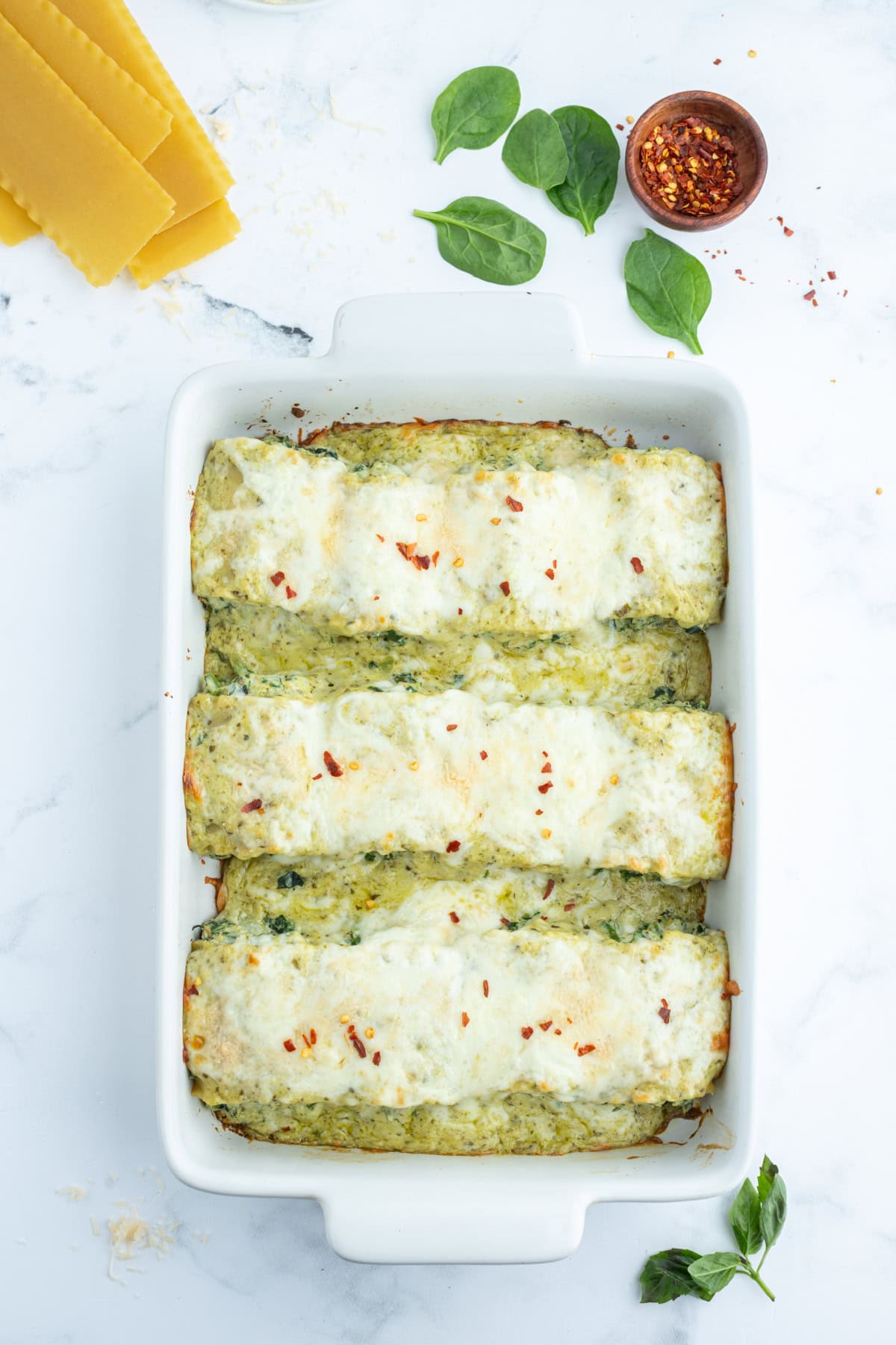 Pesto Lasagna Rolls recipe from RecipeGirl.com overhead shot of pesto lasagna rolls in casserole dish
