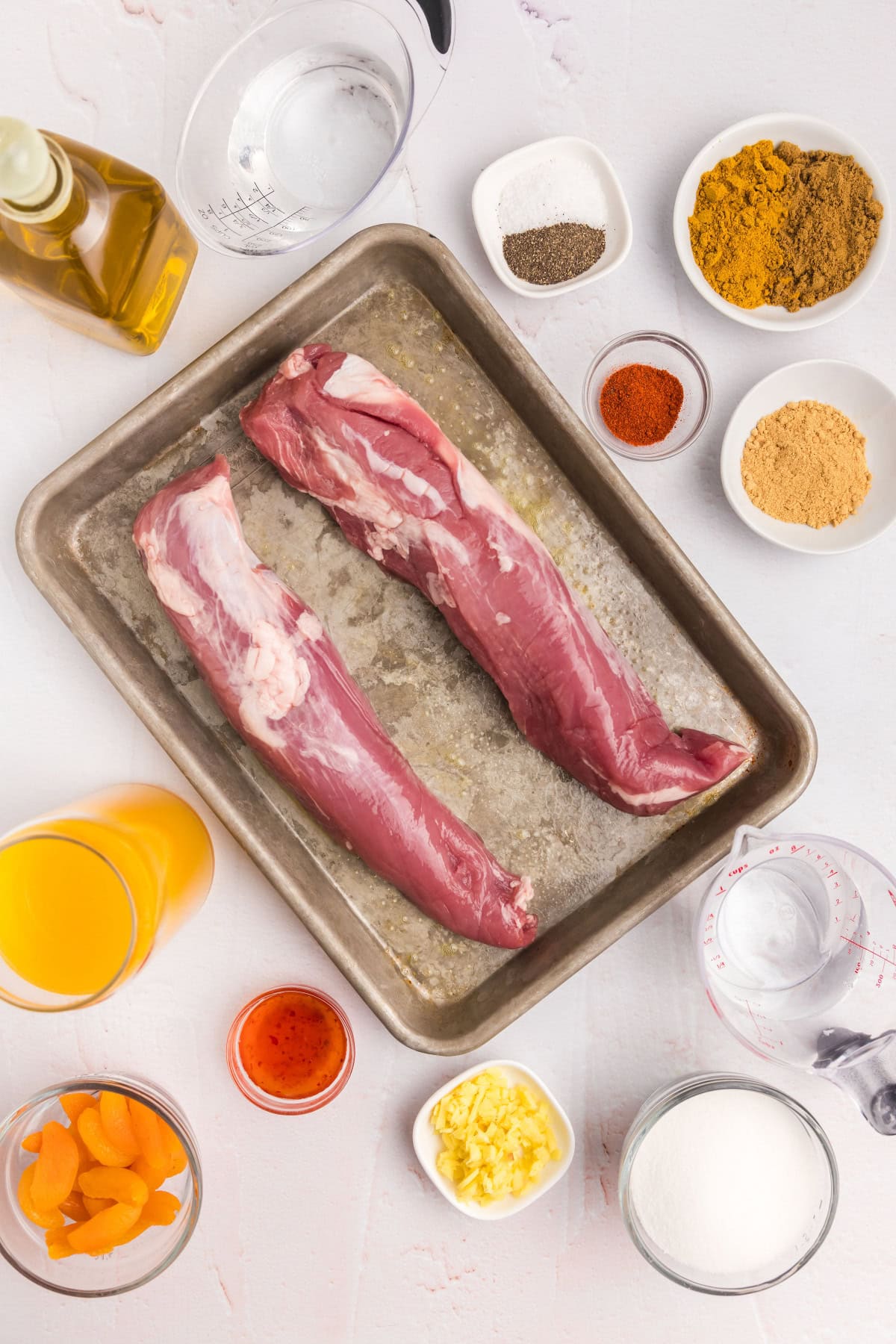 Pork Tenderloin with Apricot Ginger Sauce recipe from RecipeGirl.com ingredients displayed for making pork tenderloin with apricot ginger sauce