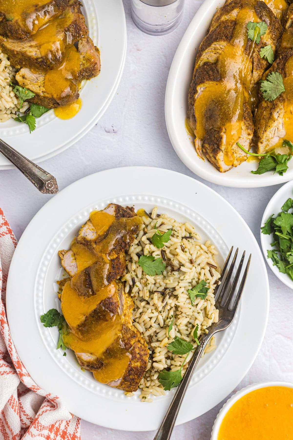 Pork Tenderloin with Apricot Ginger Sauce recipe from RecipeGirl.com sliced pork tenderloin on plate with rice