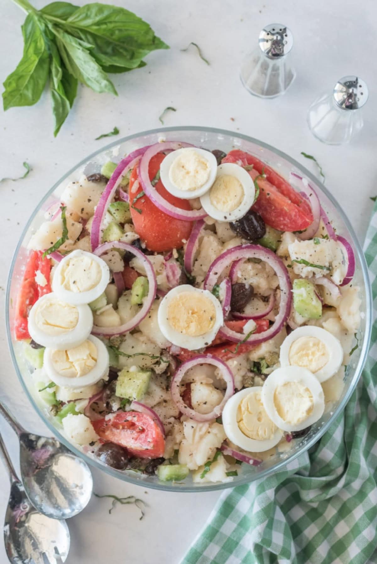 21 Favorite Potato Salad Recipes collection on RecipeGirl.com bowl of potato salad with olives tomatoes and capers