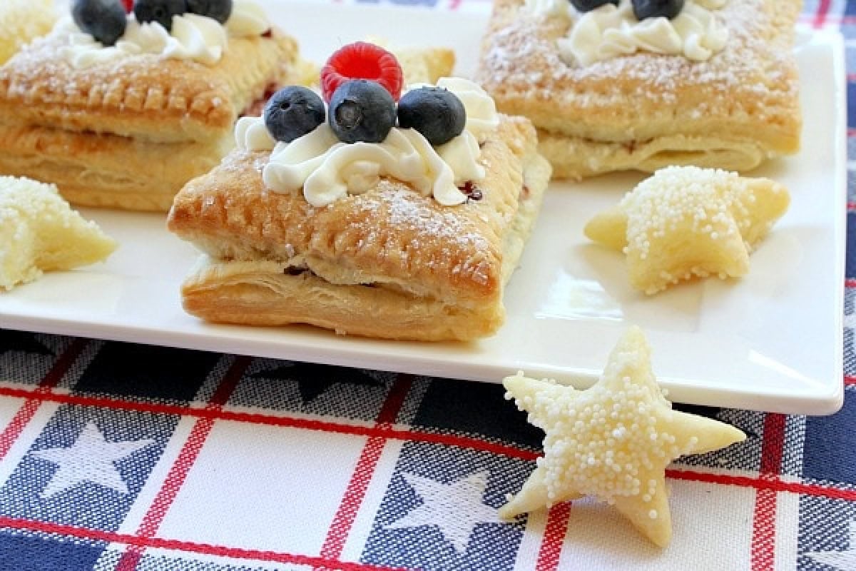 Red, White and Blue Patriotic Pastries recipe from RecipeGirl.com red white and blue pastries on plate