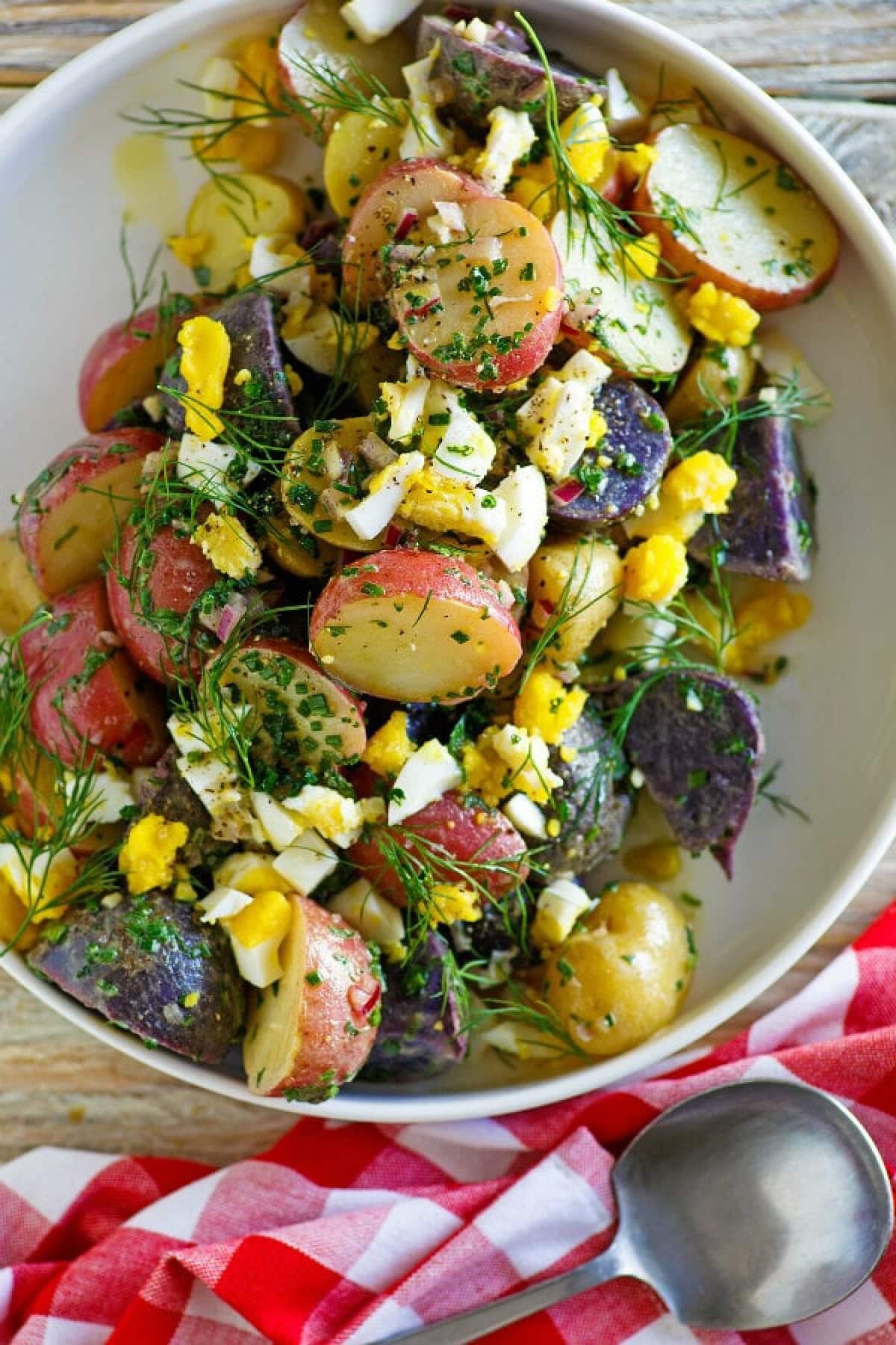 21 Favorite Potato Salad Recipes collection on RecipeGirl.com bowl of red white and blue potato salad