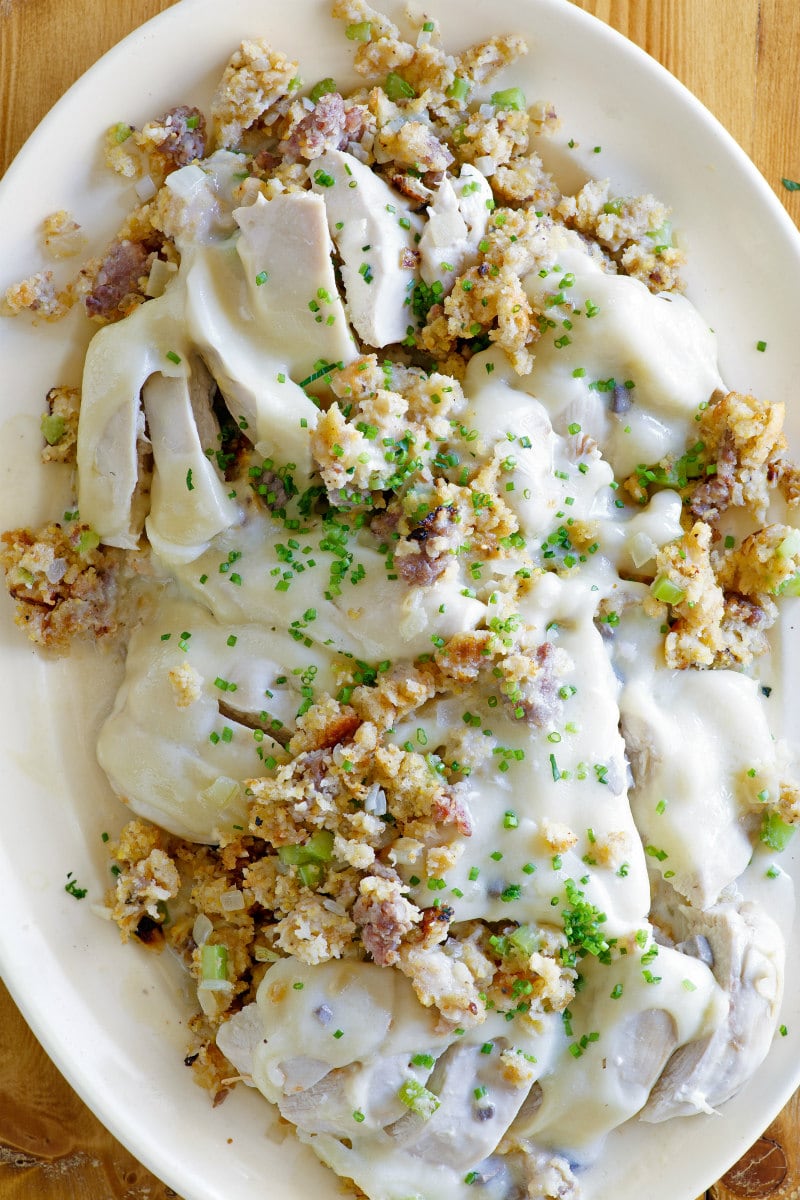 Swiss Chicken Casserole recipe from RecipeGirl.com #swiss #chicken #casserole #recipe #RecipeGirl Swiss Chicken Casserole displayed on a white platter