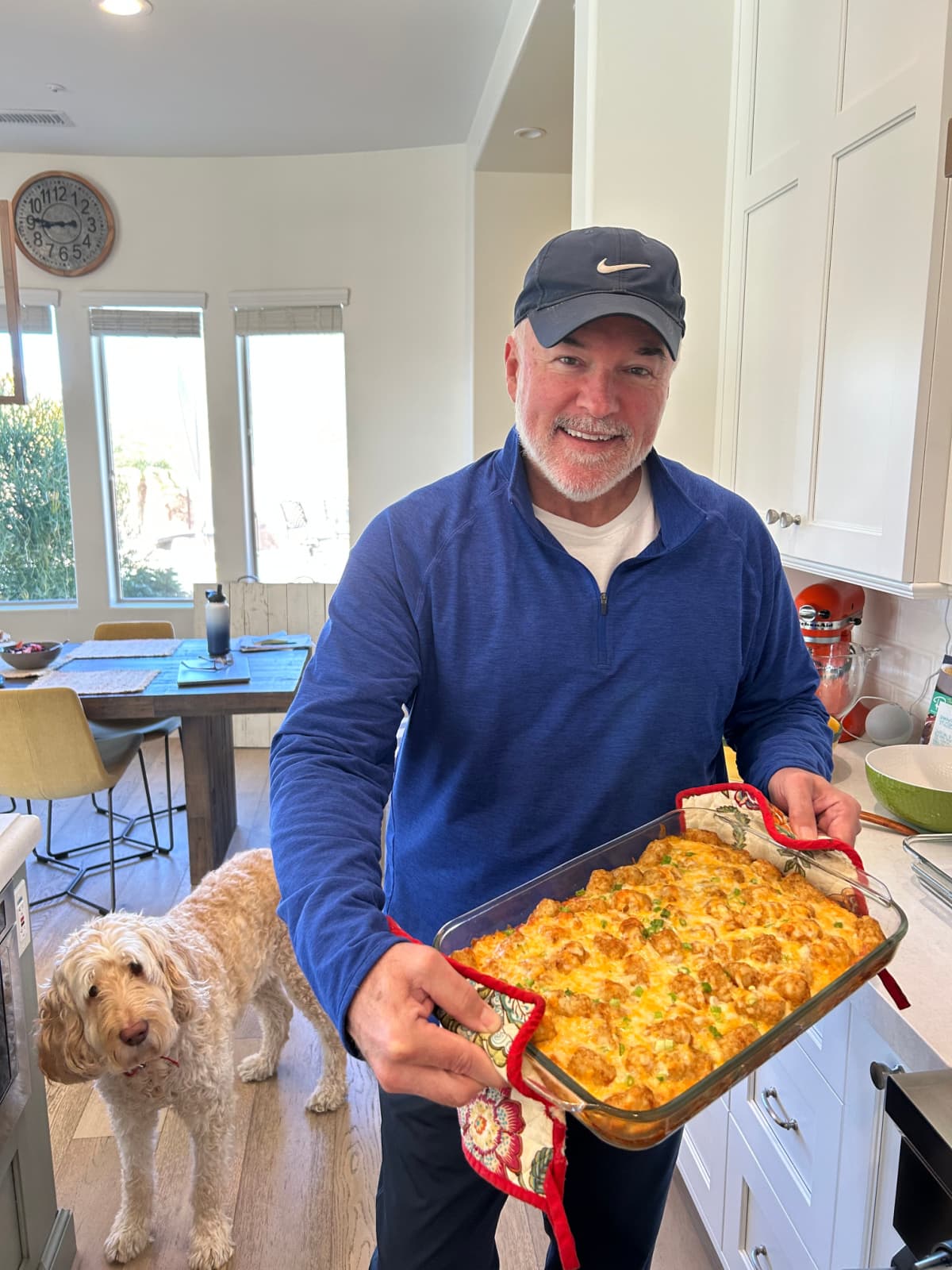 Tater Tot Breakfast Casserole recipe from RecipeGirl.com RecipeGirl husband holding tater tot breakfast casserole